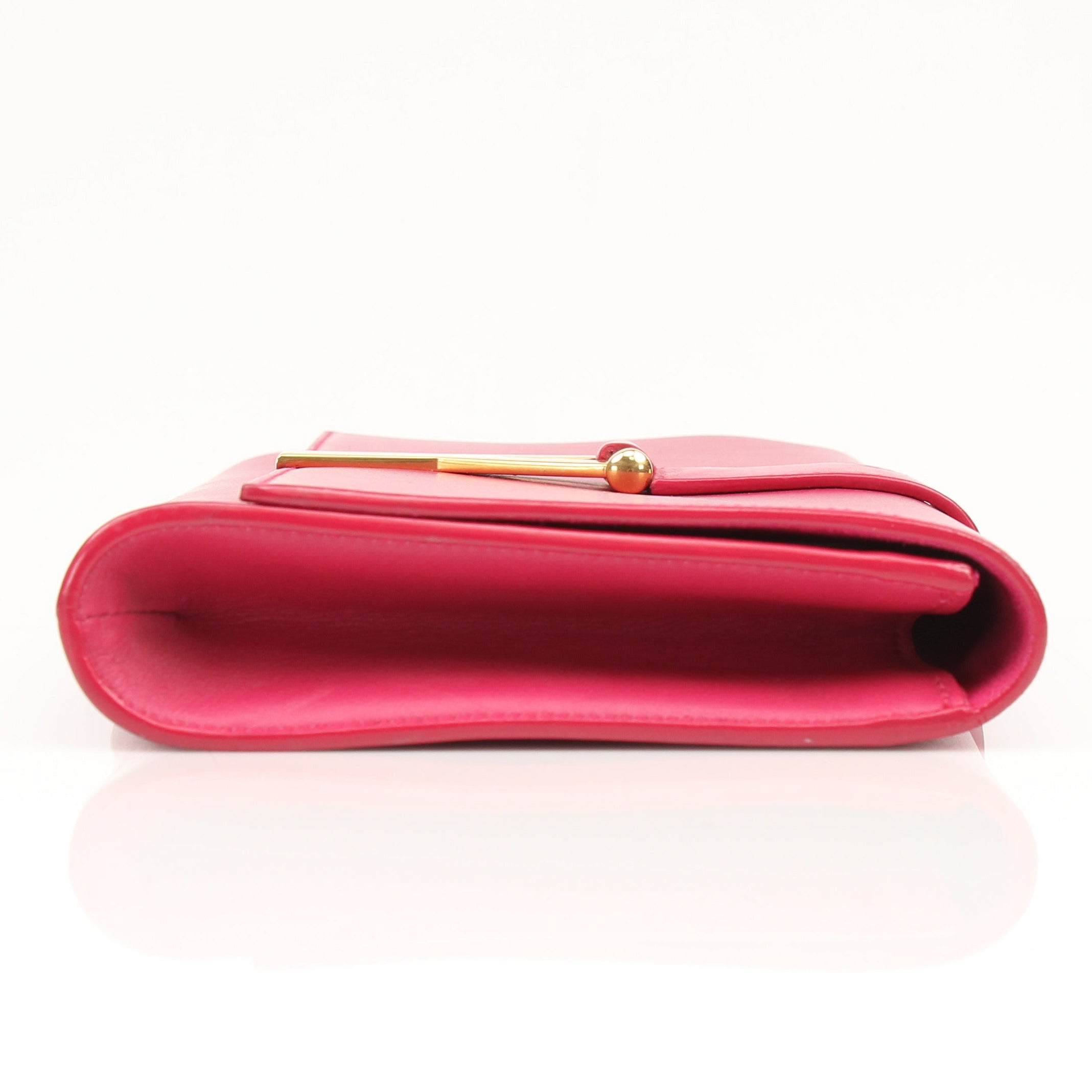 Gold & Beyond Yves Saint Laurent Chyc leather clutch handbag with sleek design and gold-tone accents.