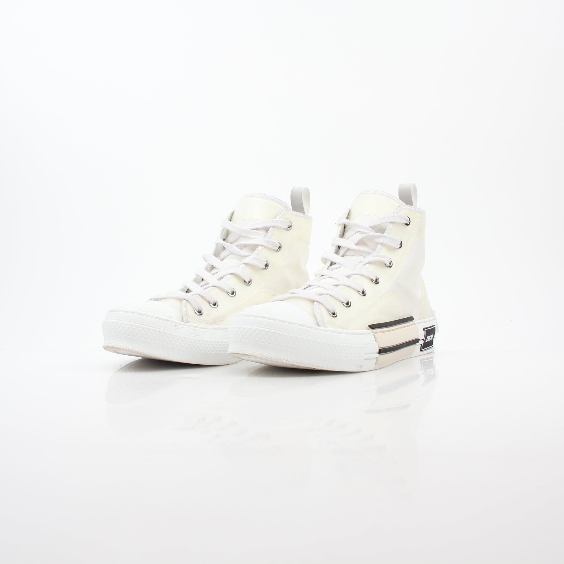 Christian Dior White B23 high-top sneakers with gold accents, stylish shoes featuring a sleek design and trendy logo details.