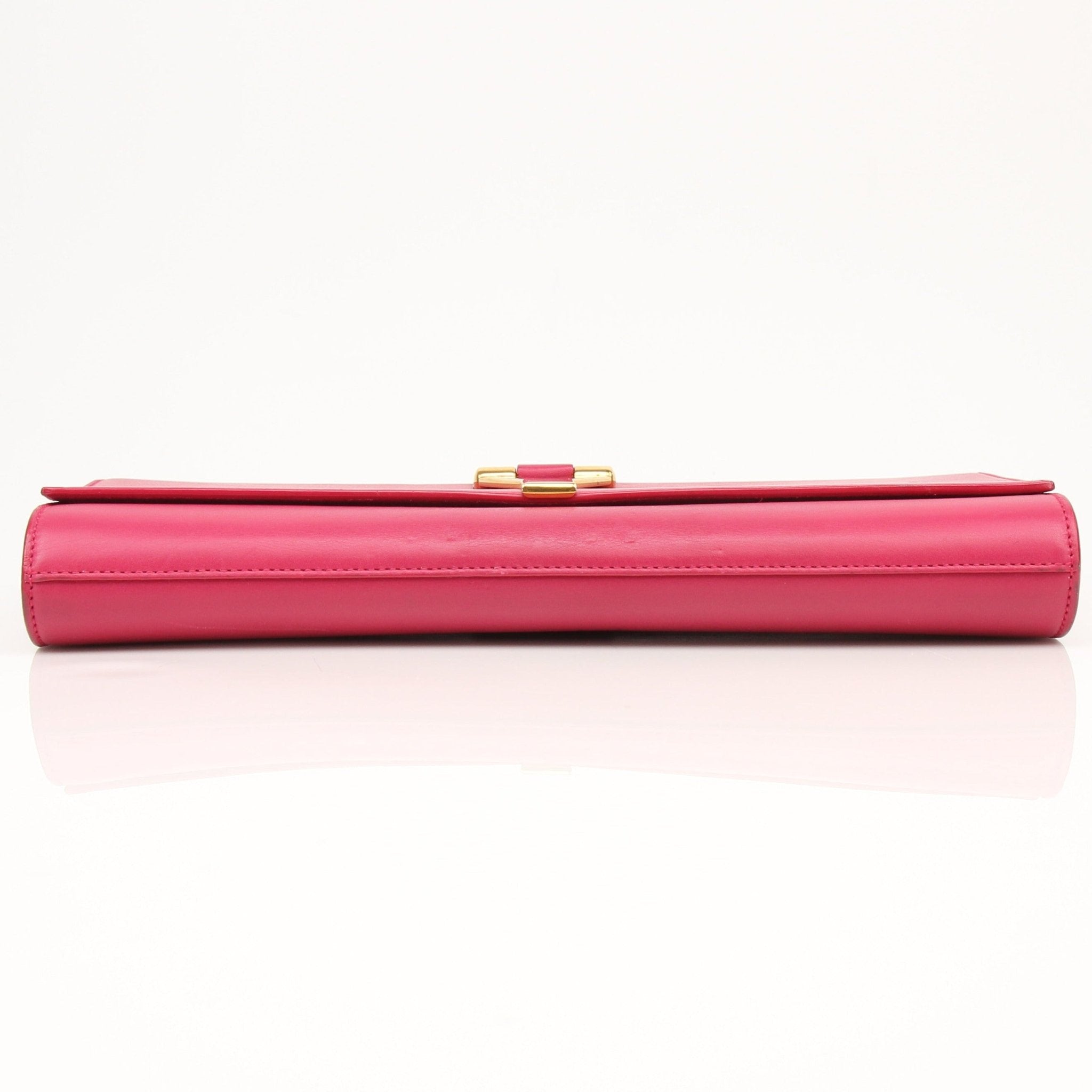Gold & Beyond Yves Saint Laurent Chyc leather clutch handbag with sleek design and gold-tone accents.
