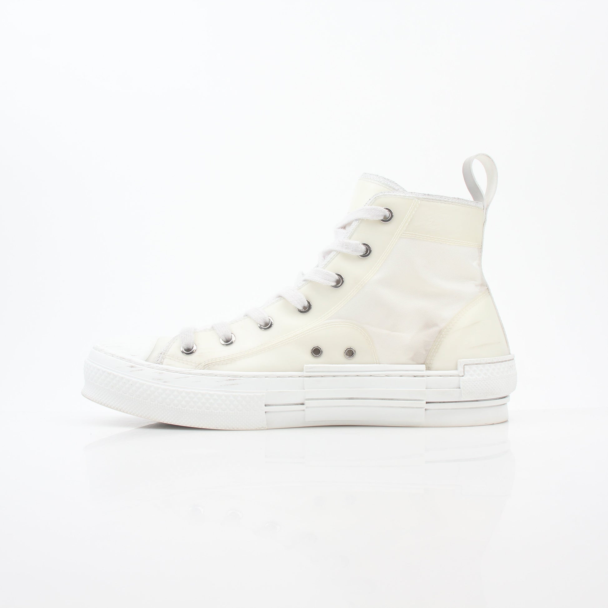 Christian Dior White B23 high-top sneakers with gold accents, showcasing the stylish design and premium material of these shoes.