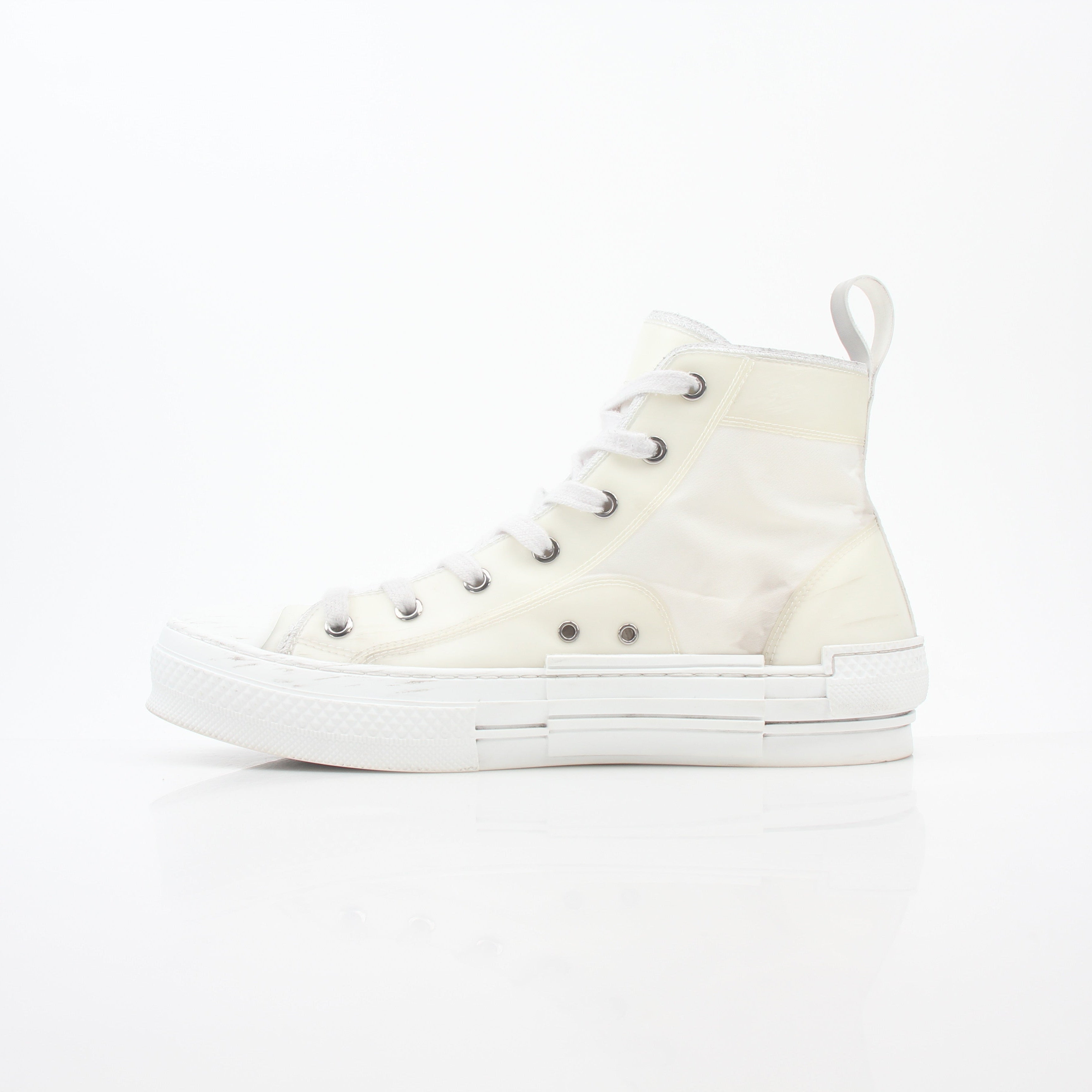 Christian Dior White B23 high-top sneakers with gold accents, showcasing the stylish design and premium material of these shoes.