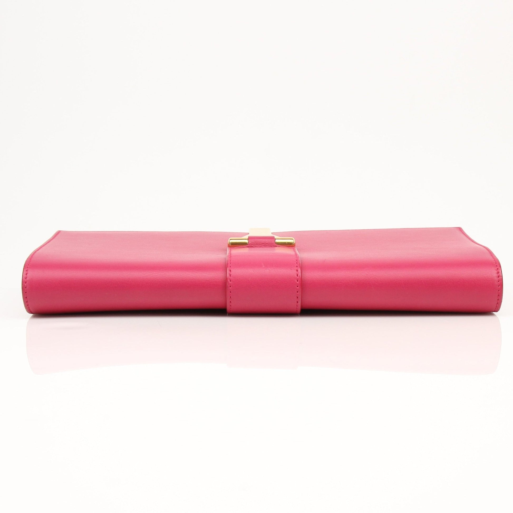 Gold & Beyond Yves Saint Laurent Chyc leather clutch handbag with sleek design and gold-tone hardware.