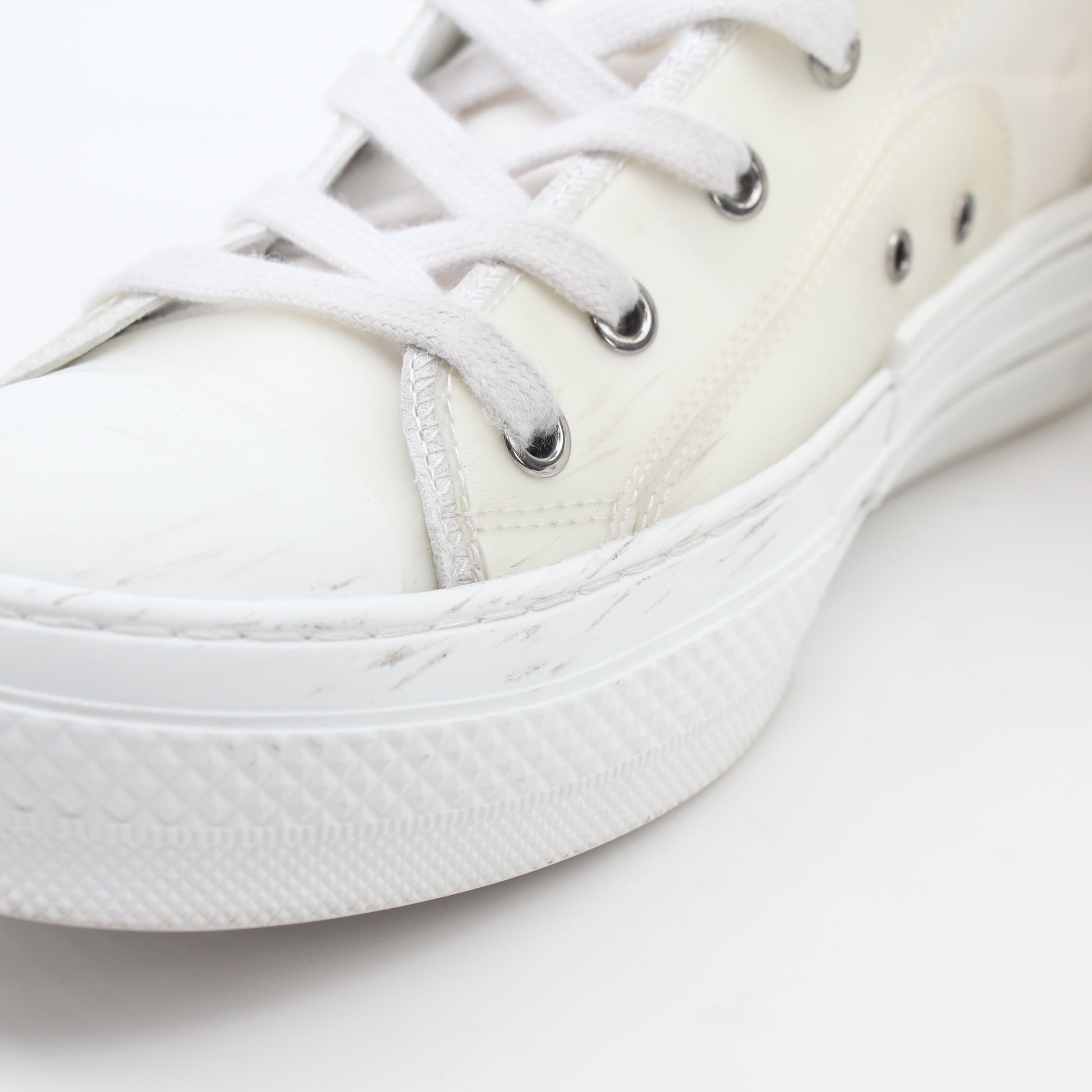 Christian Dior White B23 high-top sneakers with gold accents, featuring stylish white leather and casual sneaker design.