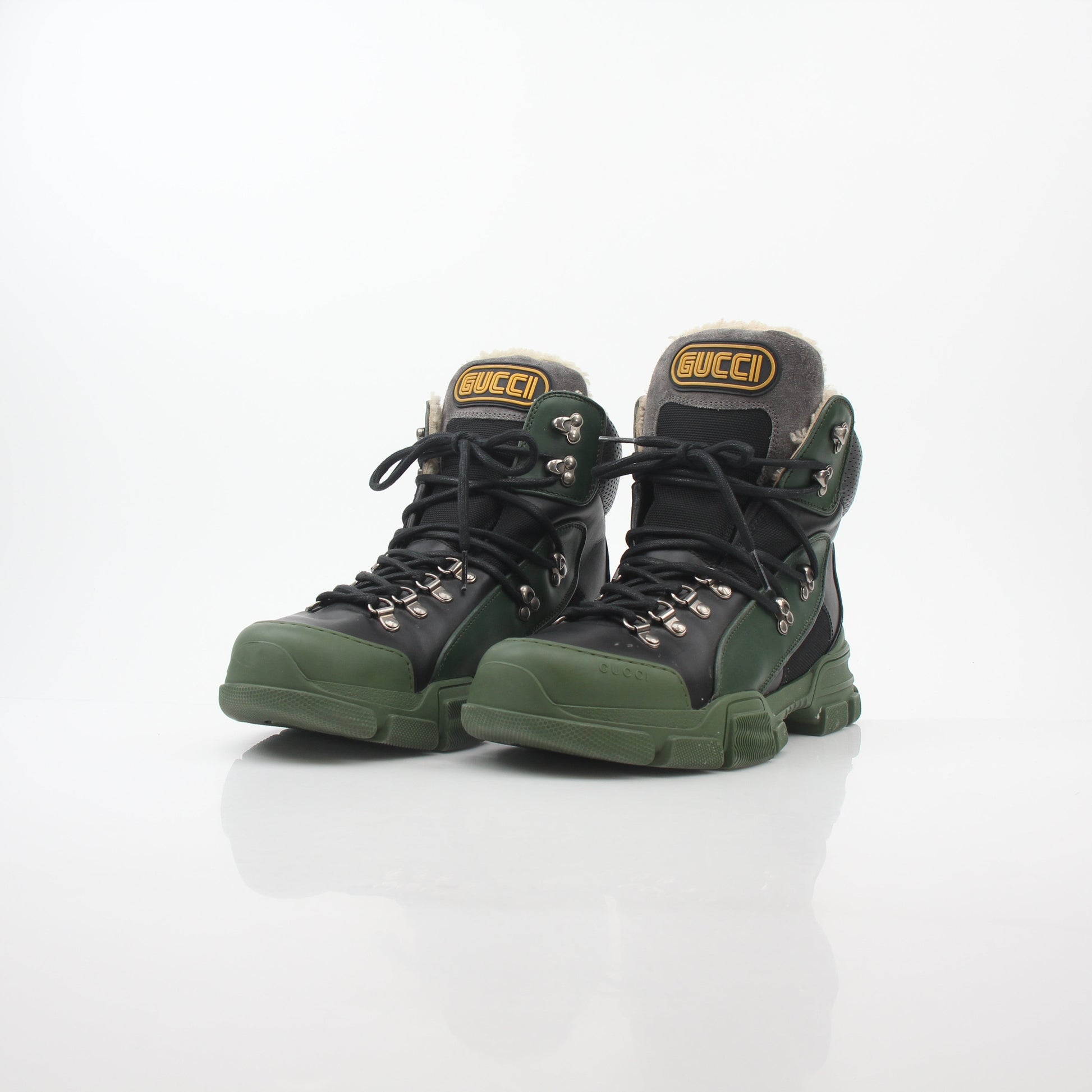 Gucci green and black Flashtrek high-top hiking boots by Gold & Beyond with rugged design and chunky soles.