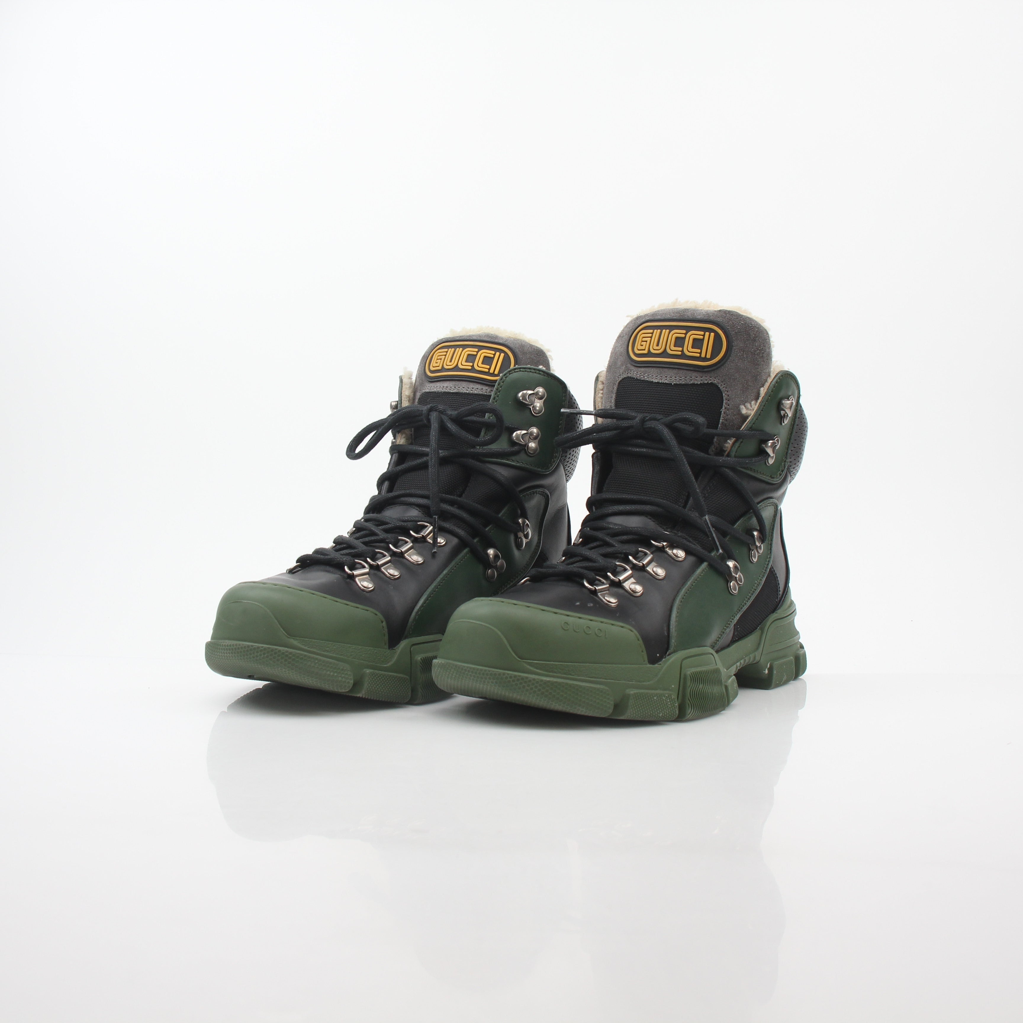 Gucci green and black Flashtrek high-top hiking boots by Gold & Beyond with rugged design and chunky soles.
