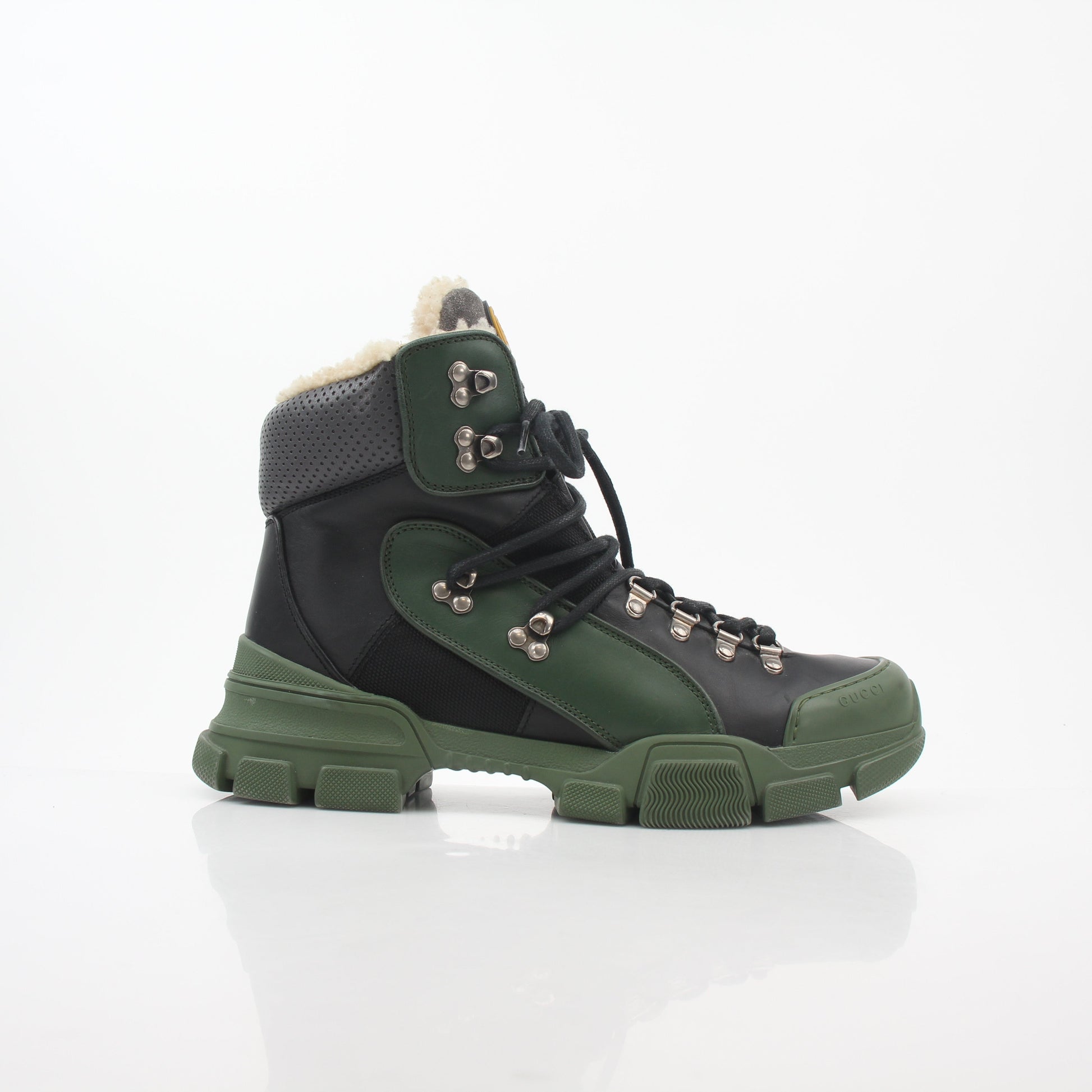 Gucci Green and Black Flashtrek high-top hiking boots with rugged design and lace-up closure, by Gold & Beyond.