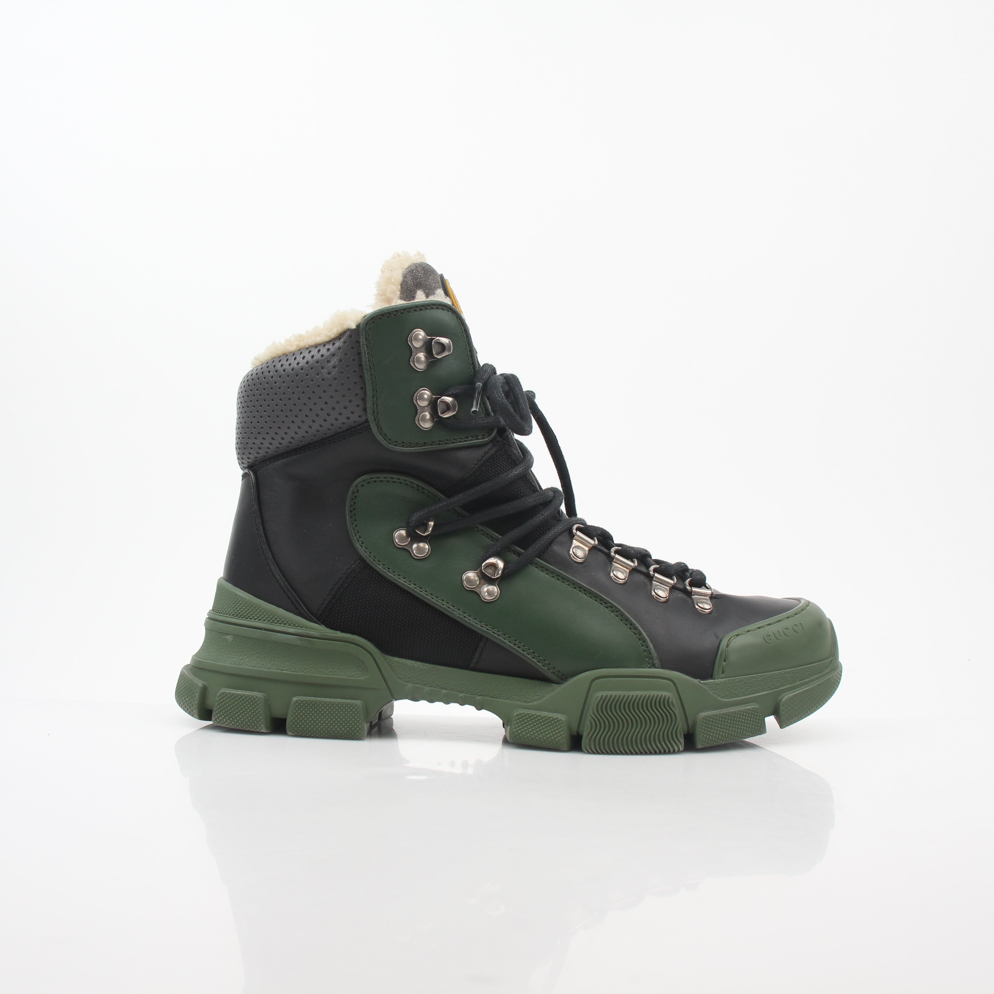 Gucci Green and Black Flashtrek high-top hiking boots with rugged design and lace-up closure, by Gold & Beyond.