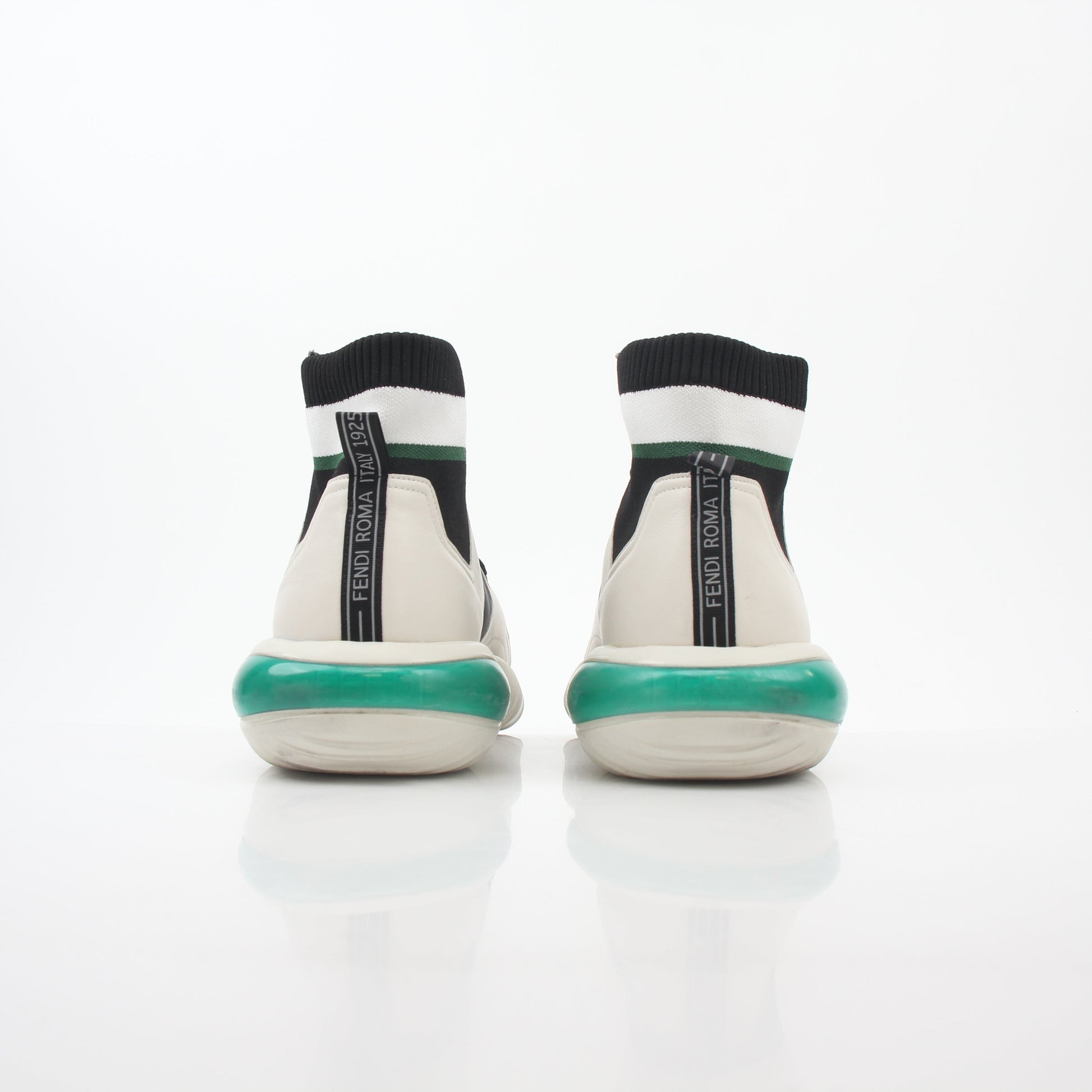 Fendi white, black, and green high-top sneakers with designer details, featuring stylish laces and a sleek shoe design.