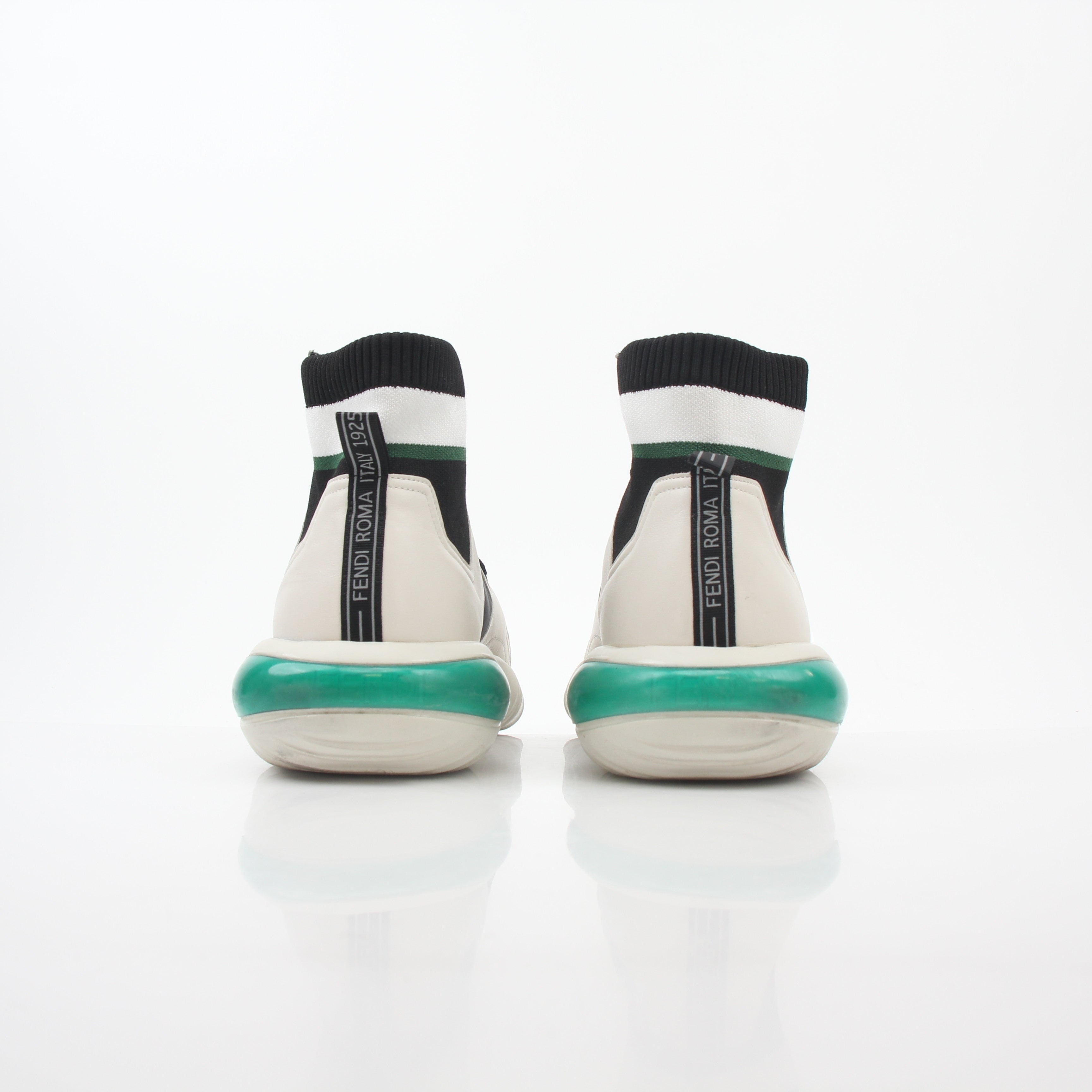 Fendi white, black, and green high-top sneakers with designer details, featuring stylish laces and a sleek shoe design.