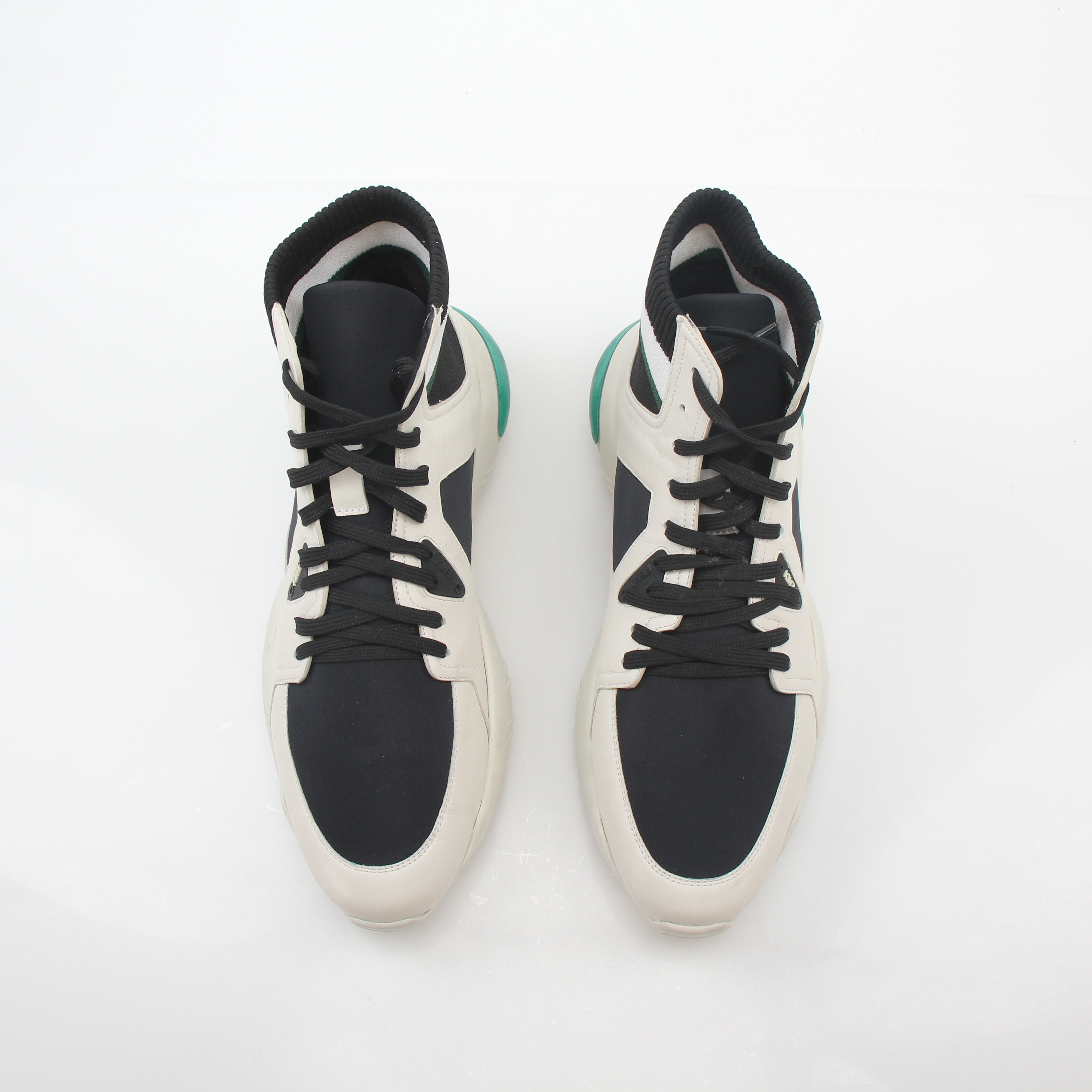 Gold & Beyond Fendi high-top sneakers in white, black, and green with stylish design and detailed branding visible.