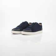Christian Louboutin navy Rantulow Orlato low-top sneakers with red sole and stylish design, featured in this image.