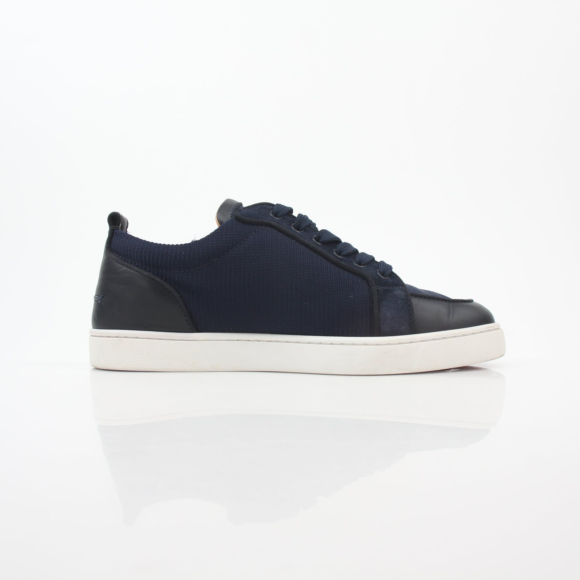 Christian Louboutin navy Rantulow Orlato low-top sneakers with signature detailing and sleek design, shown from a front angle.
