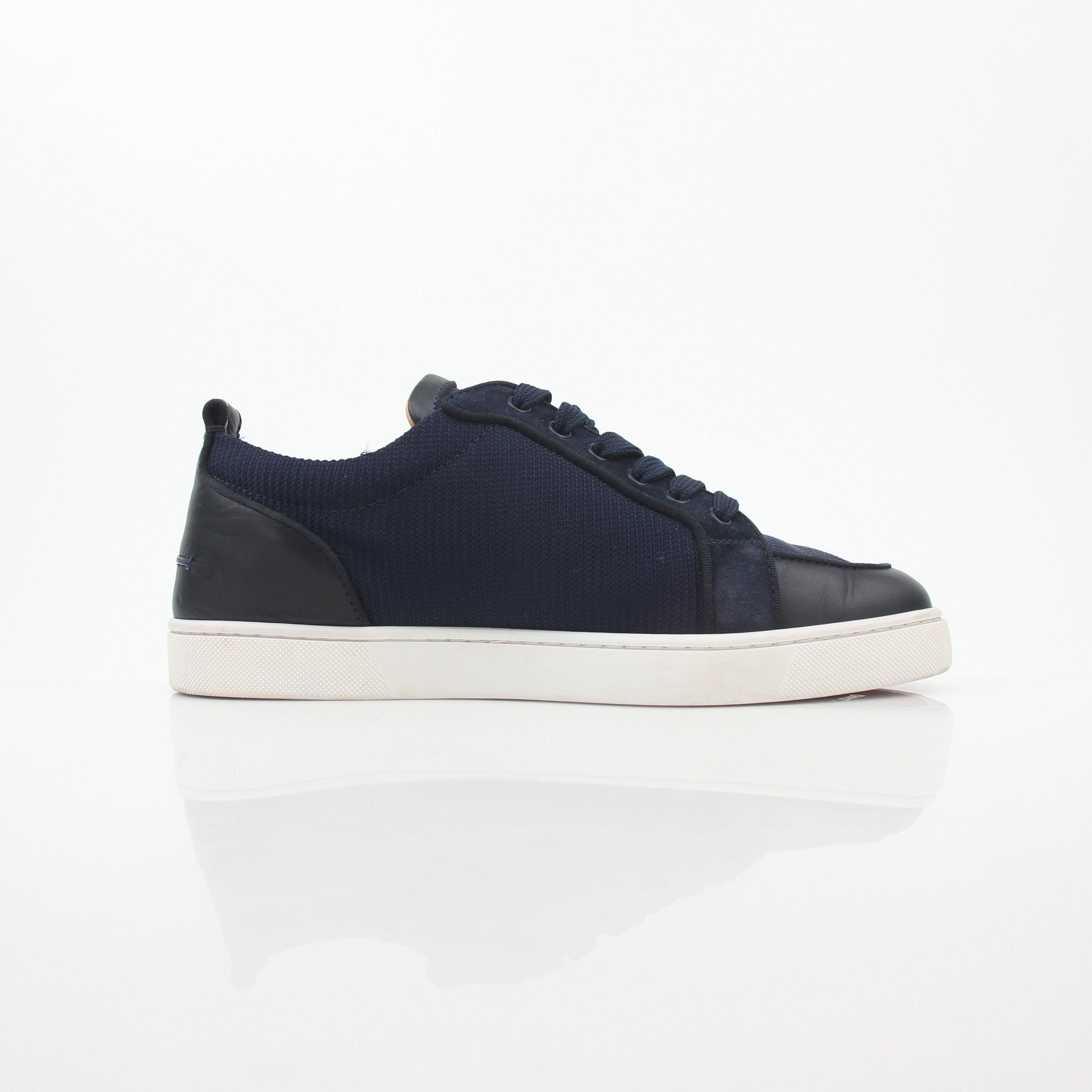 Christian Louboutin navy Rantulow Orlato low-top sneakers with signature detailing and sleek design, shown from a front angle.
