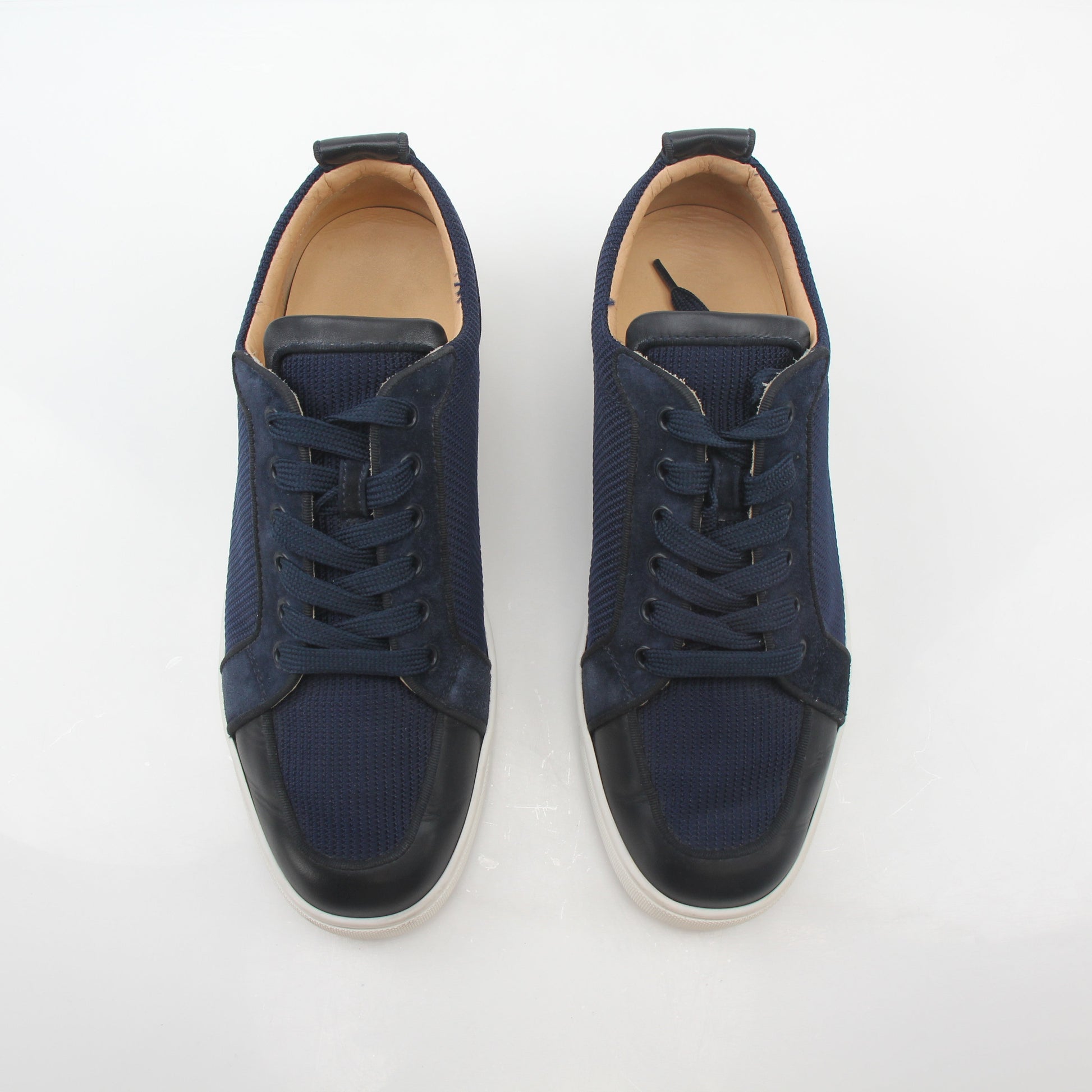 Christian Louboutin Navy Rantulow Orlato low-top sneakers with signature red sole and stylish navy leather upper.