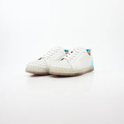 Christian Louboutin White Varsijunior Spikes 2 low-top sneakers with studded details and white leather, displayed on a plain background.
