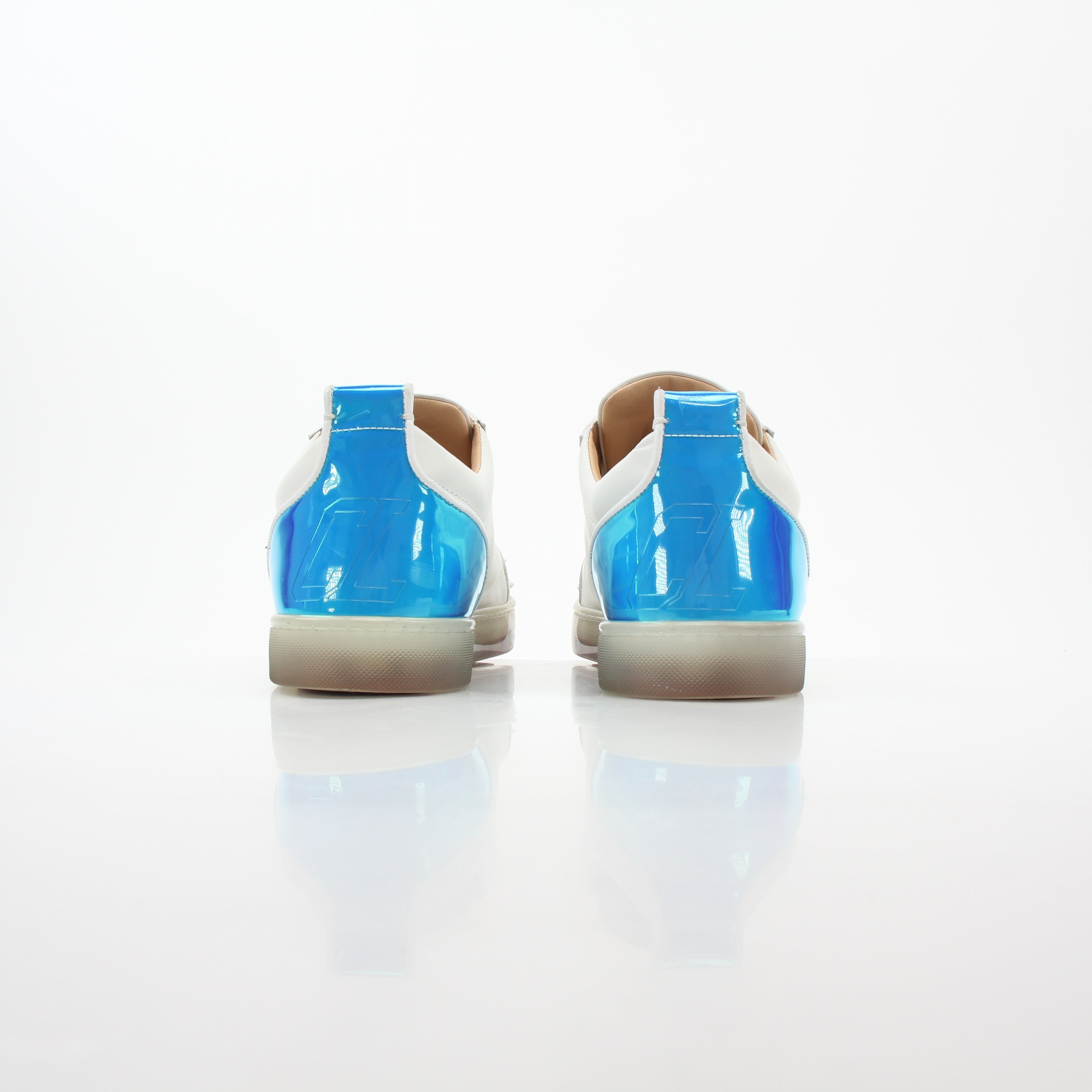 Christian Louboutin Varsijunior Spikes white low-top sneakers with black spikes, casual shoes for stylish footwear.