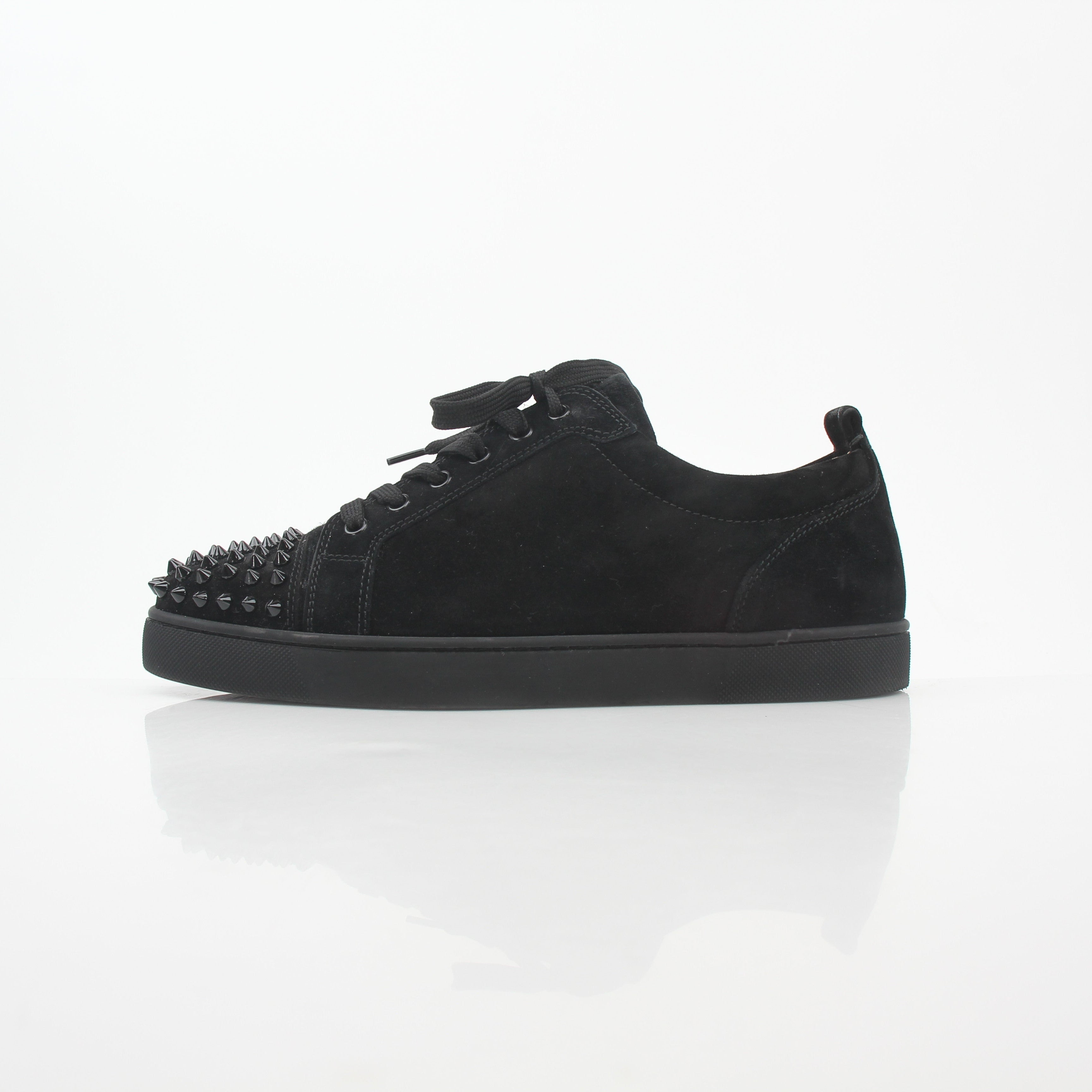 Christian Louboutin Louis Junior Spikes low-top sneakers in black with gold accents and spike detailing, casual shoes for men.