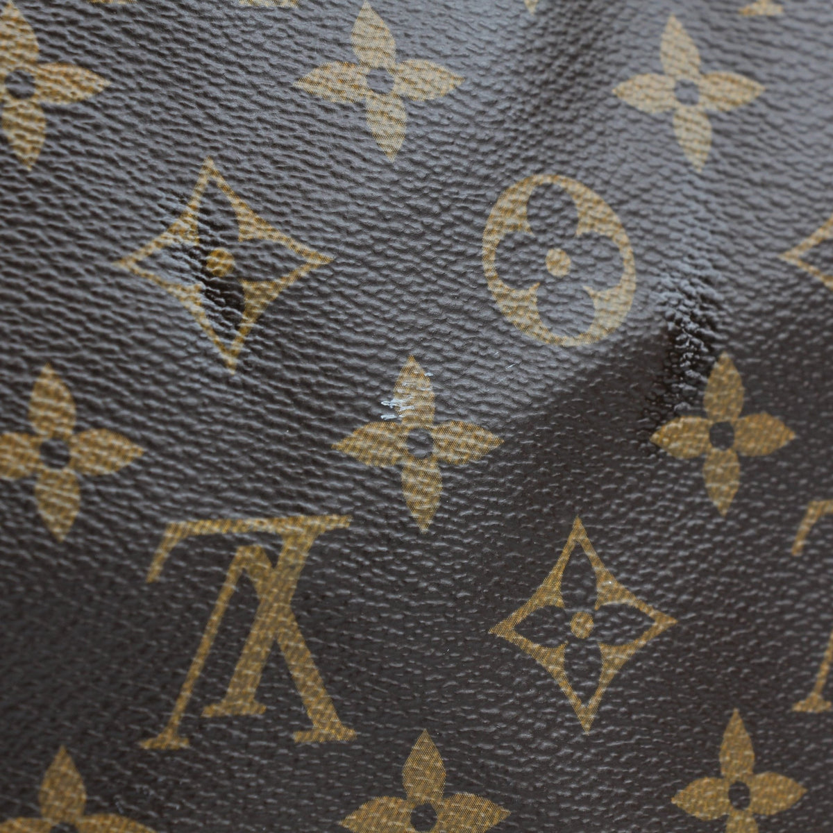 Louis Vuitton Brown Monogram Keepall Bandoulière 45 duffel bag, travel bag with leather trim and gold-tone hardware, displayed on a white background