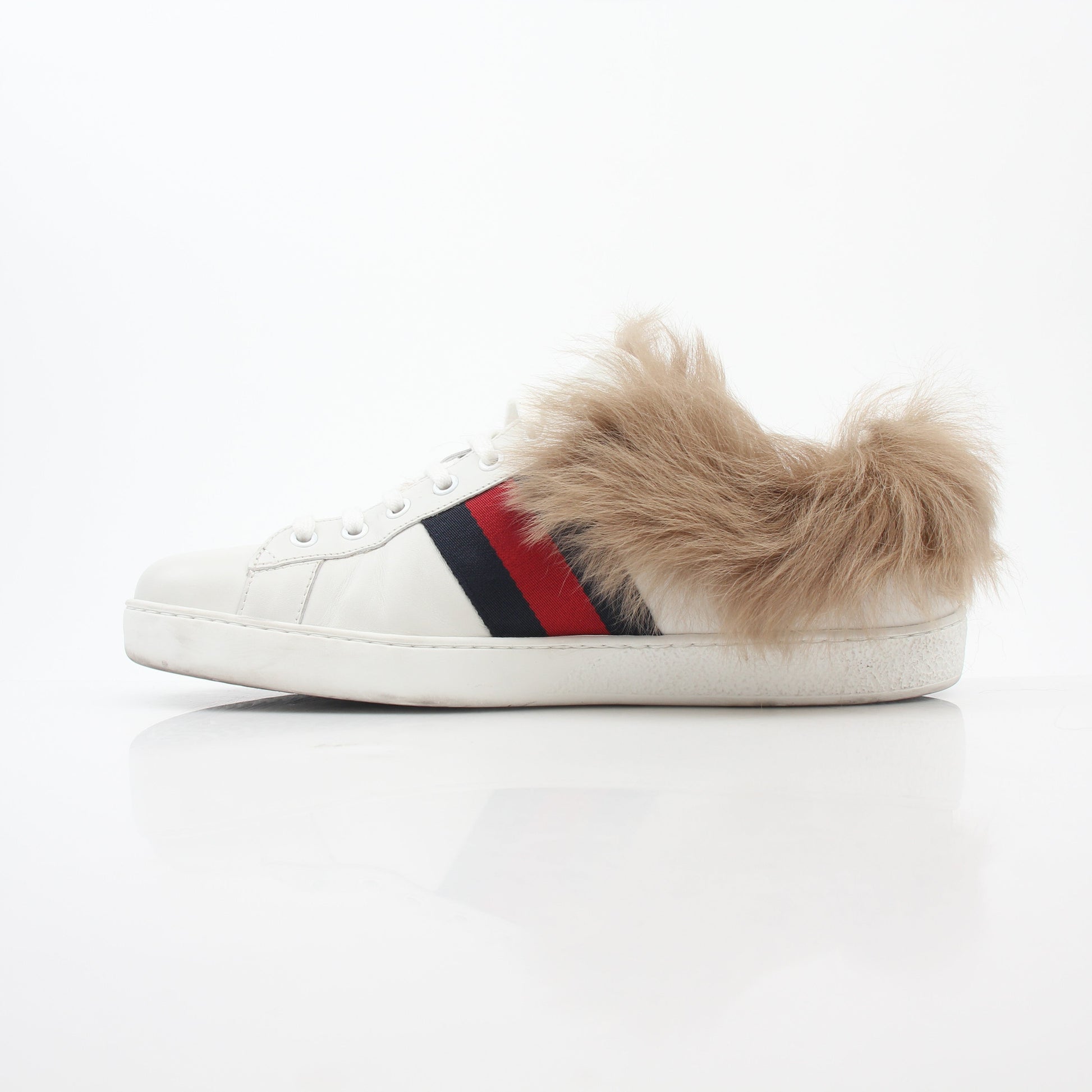 Gucci White Ace embroidered bee fur low-top sneakers with gold accents, displayed on a clean background.