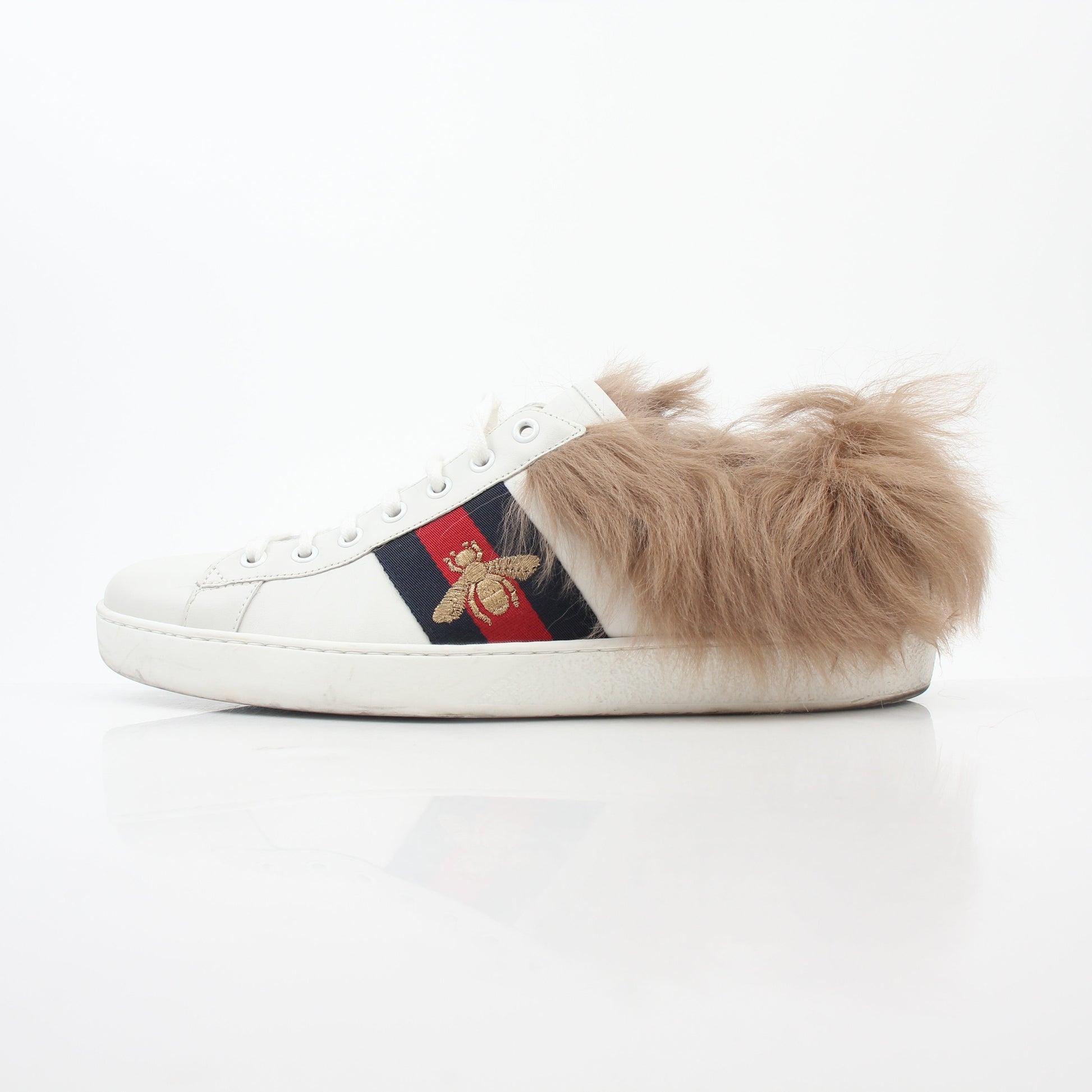 Gold & Beyond Gucci White Ace sneakers with embroidered bee detail, low-top shoes with fur accents and stylish design.