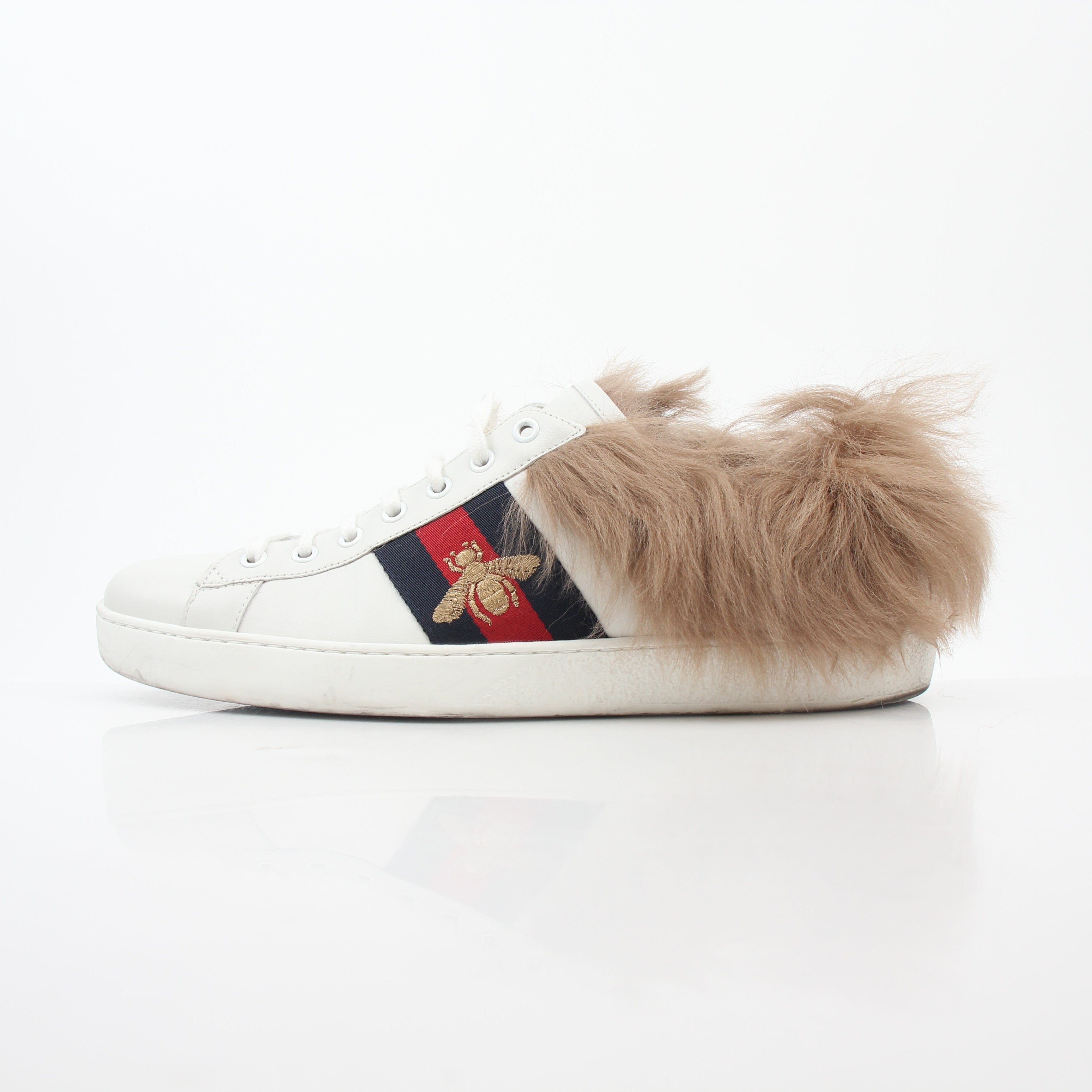Gold & Beyond Gucci White Ace sneakers with embroidered bee detail, low-top shoes with fur accents and stylish design.
