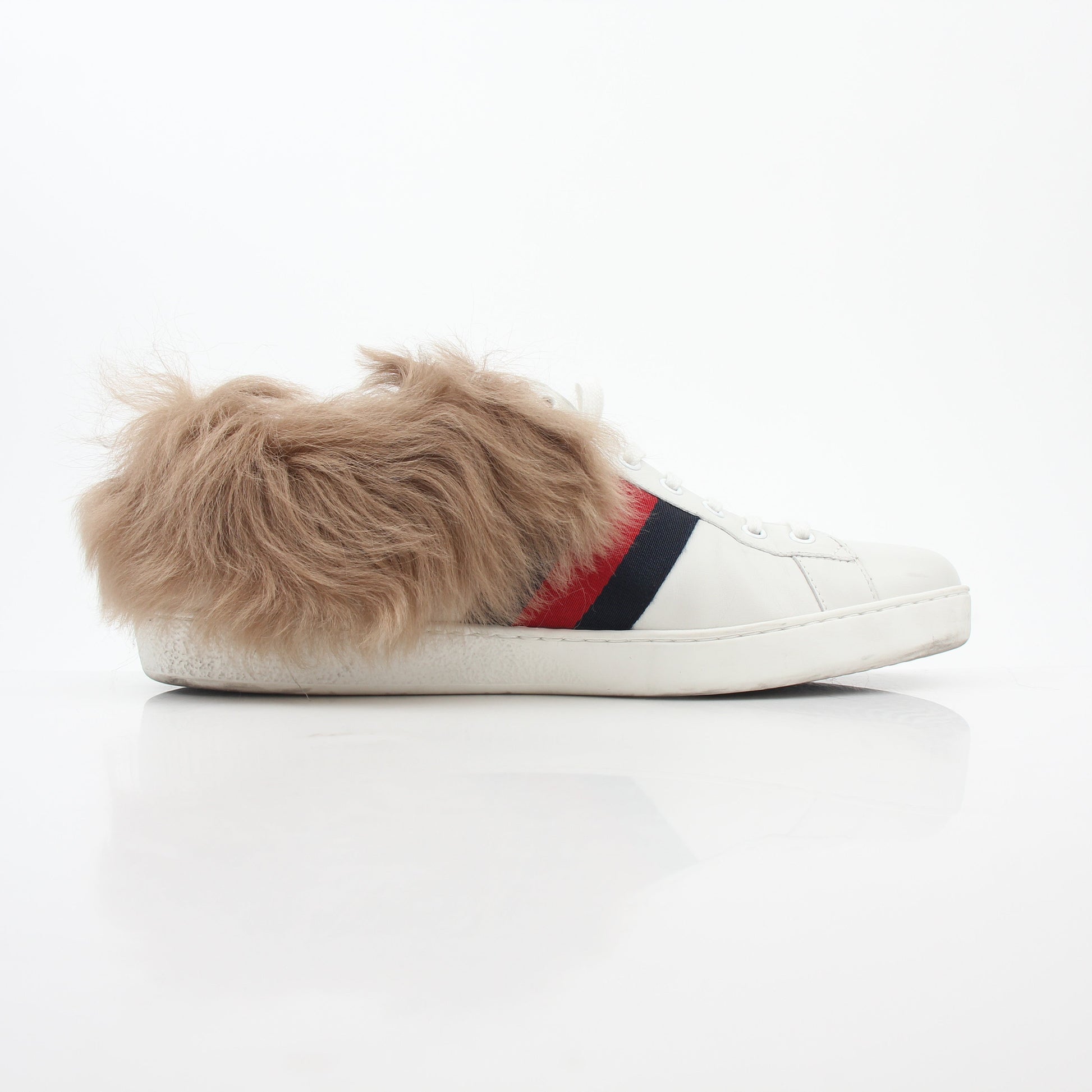 Gucci white Ace embroidered bee fur low-top sneakers featuring detailed bee embroidery and plush fur accents.