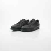 Gold & Beyond Gucci Black Tennis 1984 low-top sneakers with sleek design and signature branding, displayed on a clean background.