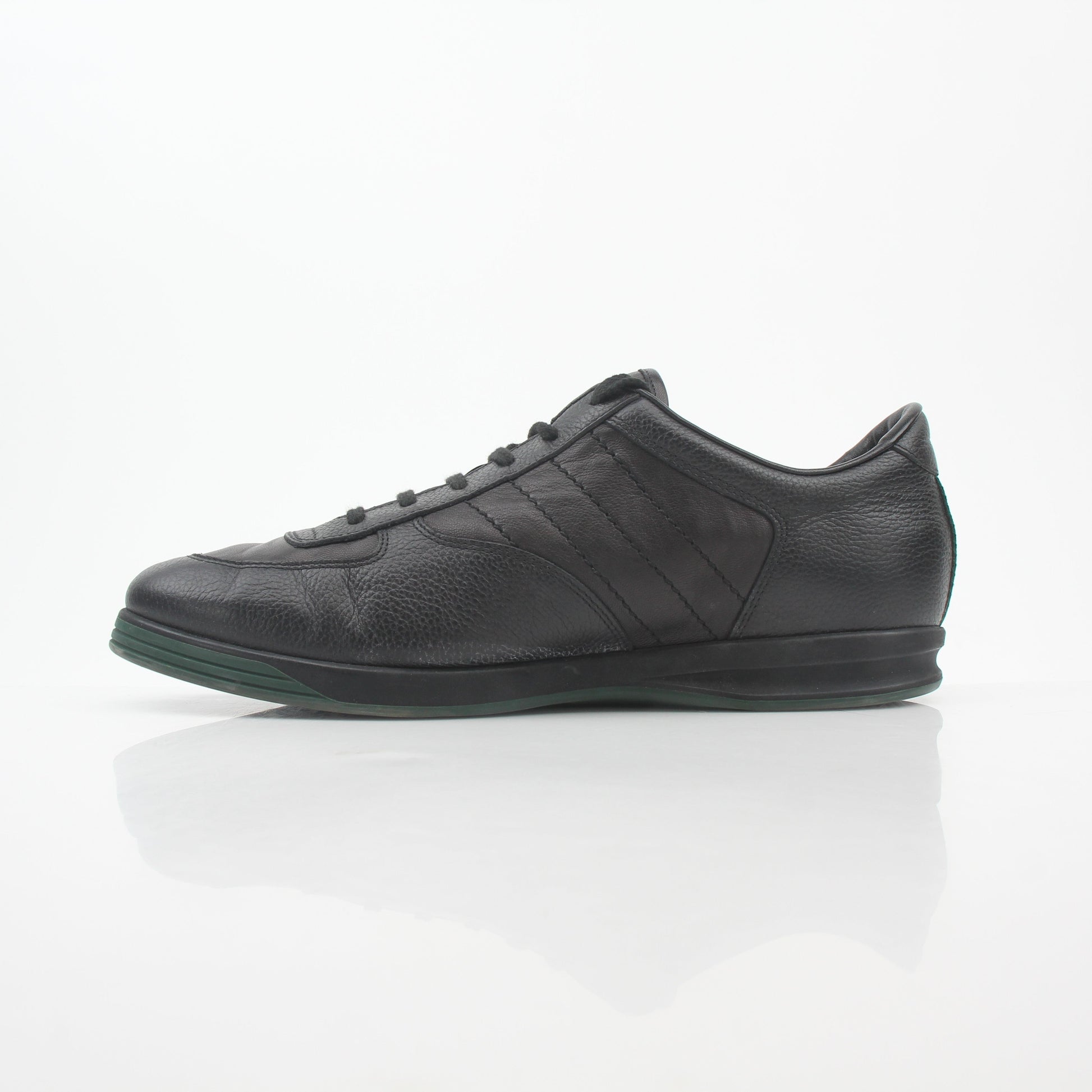 Gold & Beyond Gucci Black Tennis 1984 low-top sneakers with white laces and rubber soles, casual athletic shoes for men.
