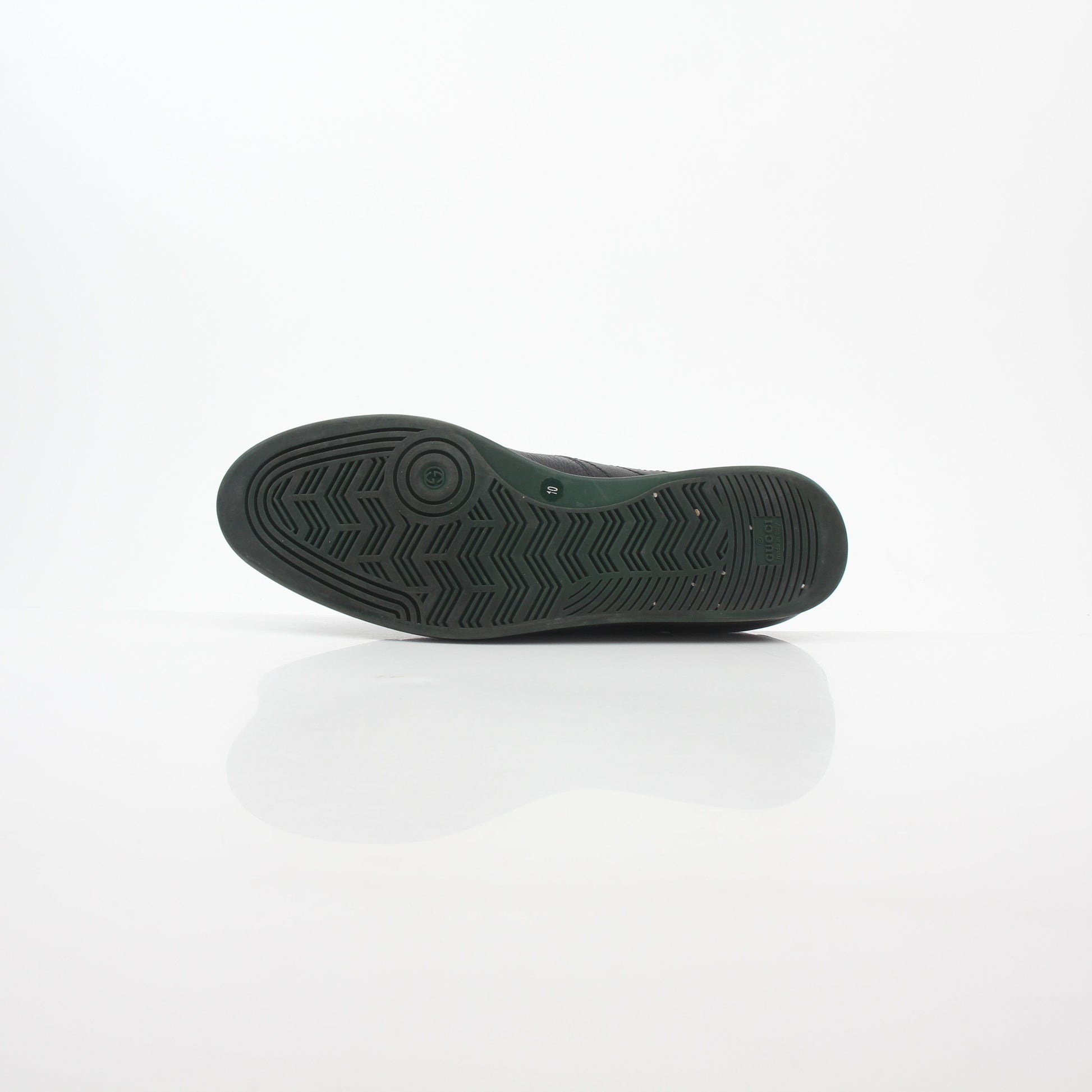 Gold & Beyond Gucci Black Tennis 1984 low-top sneakers with white rubber soles and classic Gucci logo detail.