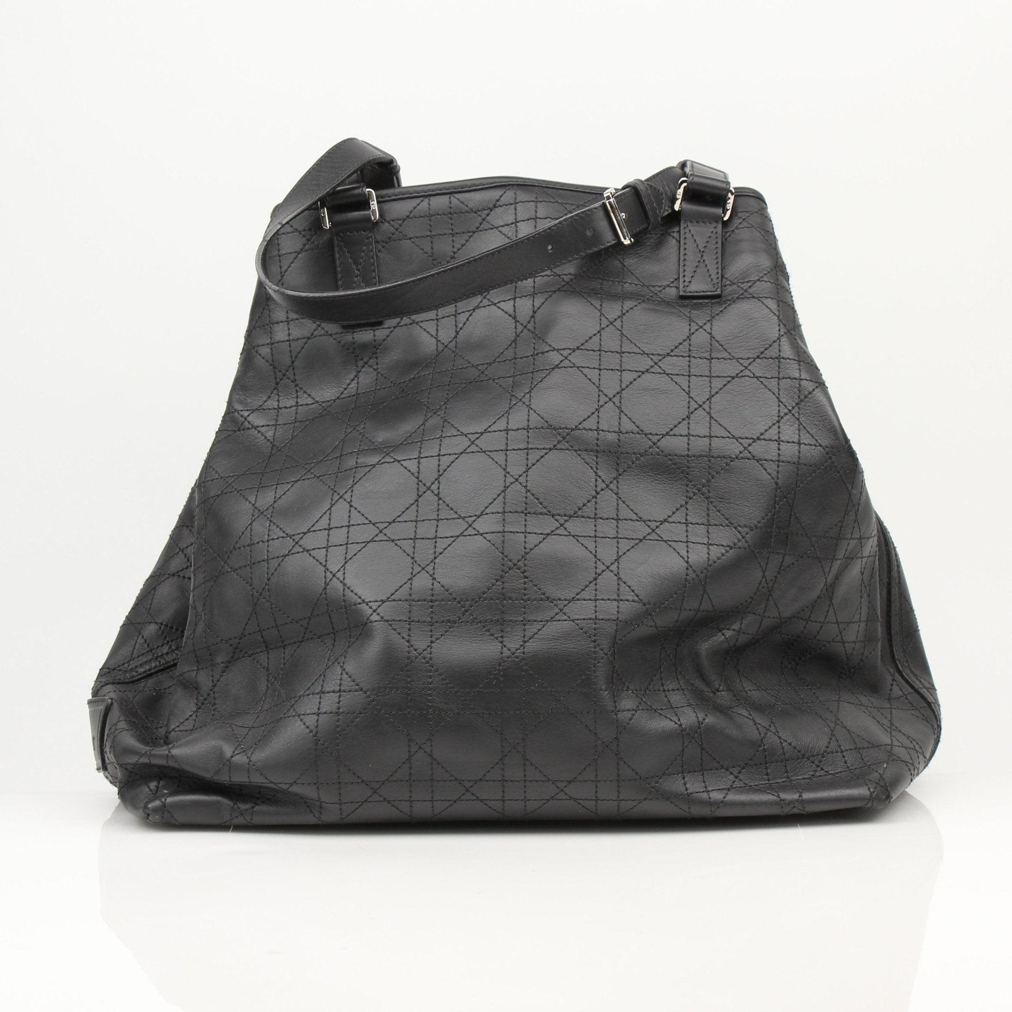Christian Dior Rasta Cannage Tote travel bag with rasta-inspired design and gold-tone accents, crafted from premium materials.