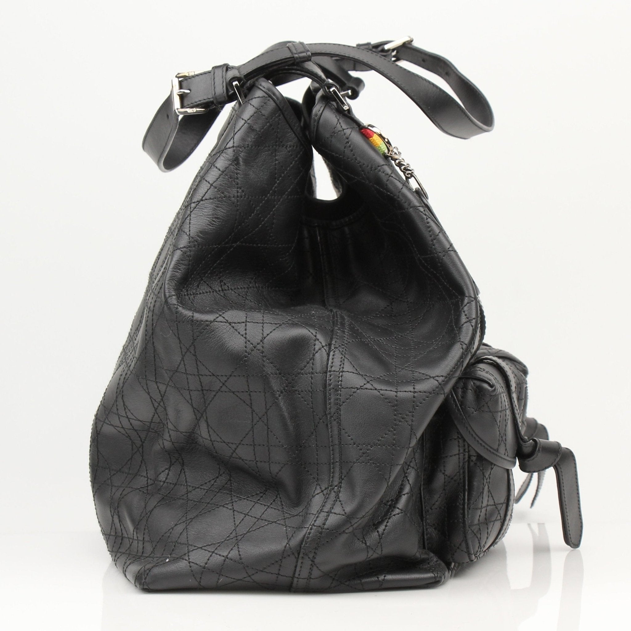 Christian Dior Rasta Cannage Tote travel bag with vibrant rasta-inspired design and gold-tone details, crafted with luxurious leather.