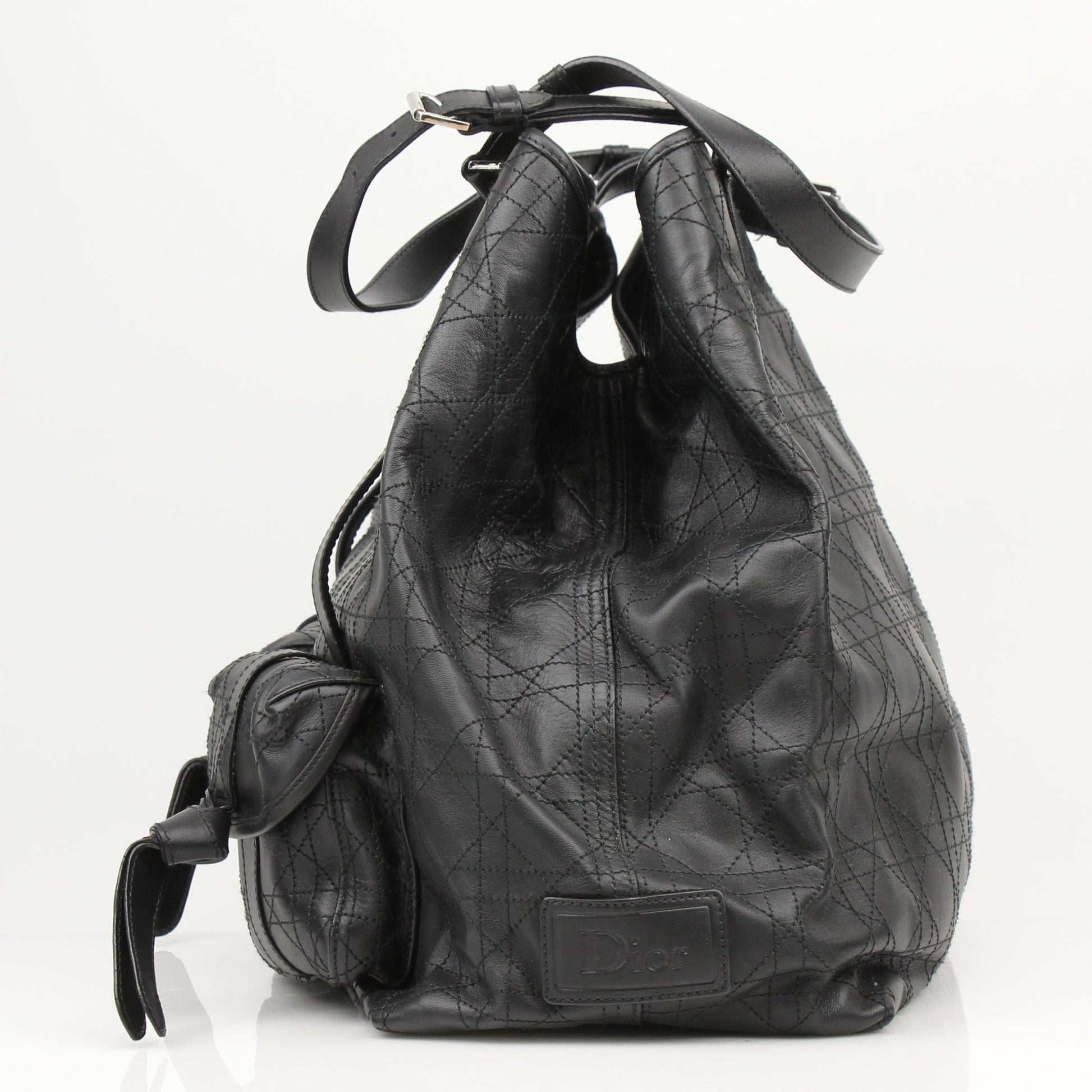 Christian Dior Rasta Cannage tote bag with colorful rasta design, featuring leather handles and spacious travel bag style.