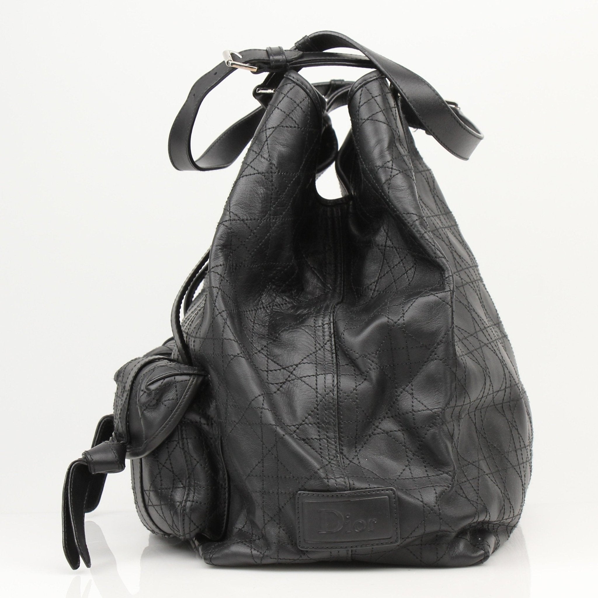 Christian Dior Rasta Cannage tote bag with colorful rasta design, featuring leather handles and spacious travel bag style.
