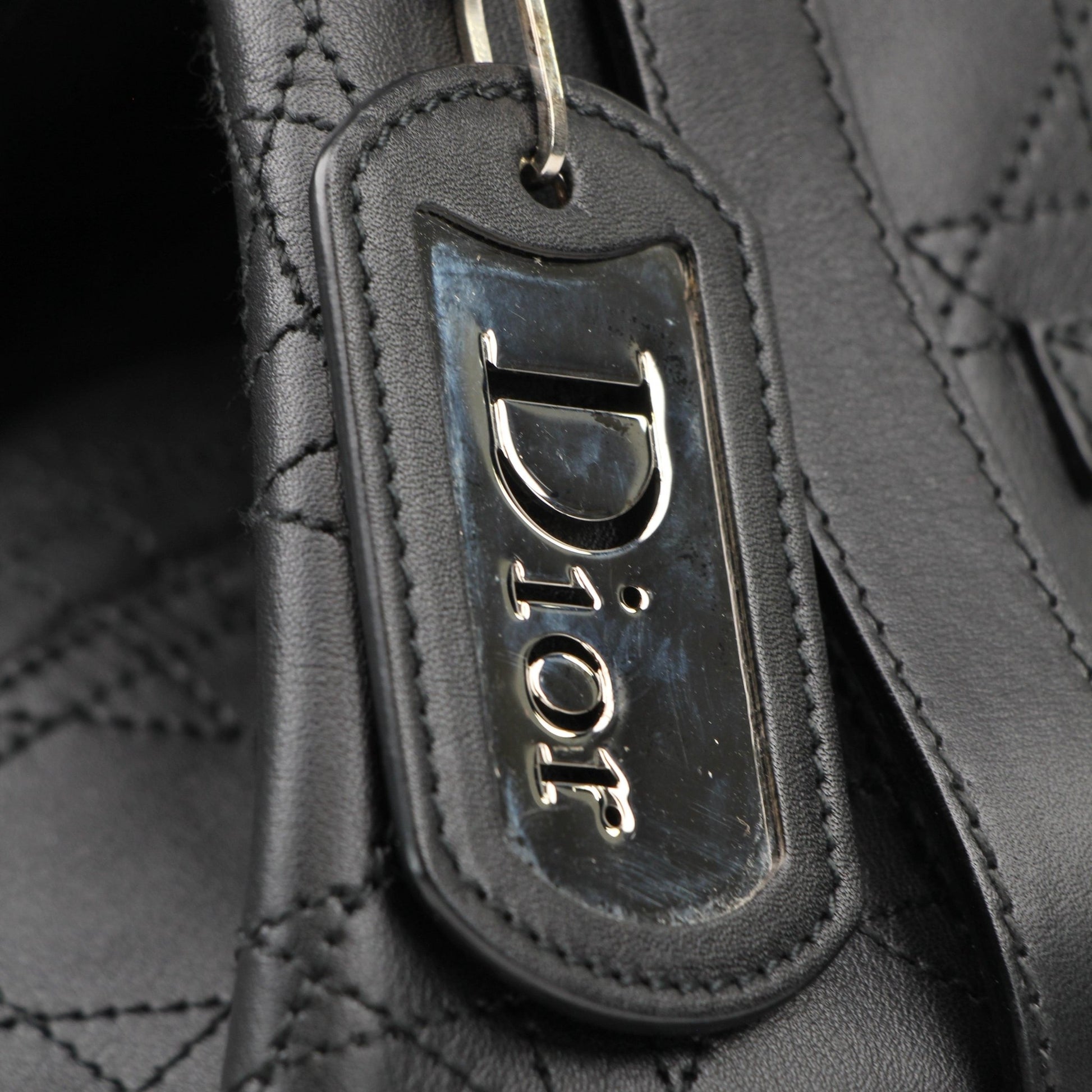 Christian Dior Rasta Cannage Tote travel bag with colorful Rasta design and woven leather details, stylish and spacious for travel.
