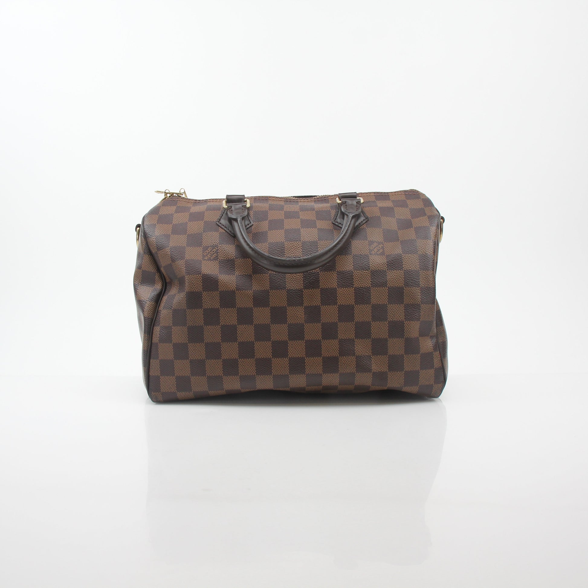 Louis Vuitton Damier Ebene Speedy Bandoulière 30 handbag with leather handles and gold-tone hardware, featuring signature checkered pattern.