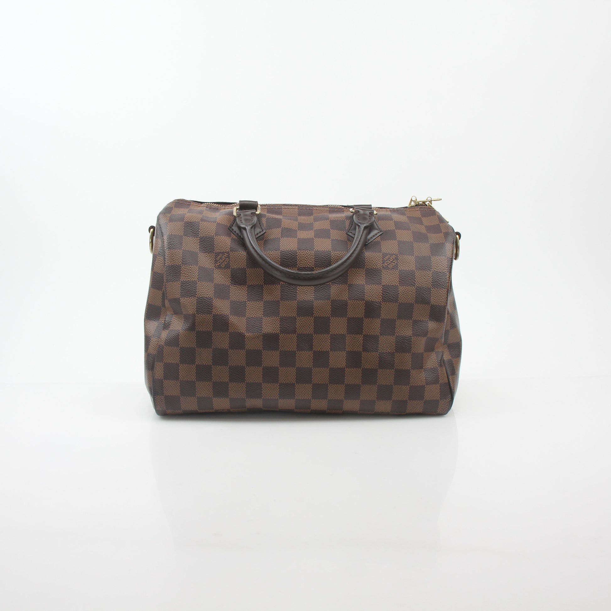 Louis Vuitton Damier Ebene Speedy Bandoulière 30 handbag with leather trim and gold hardware, displayed on a plain background.