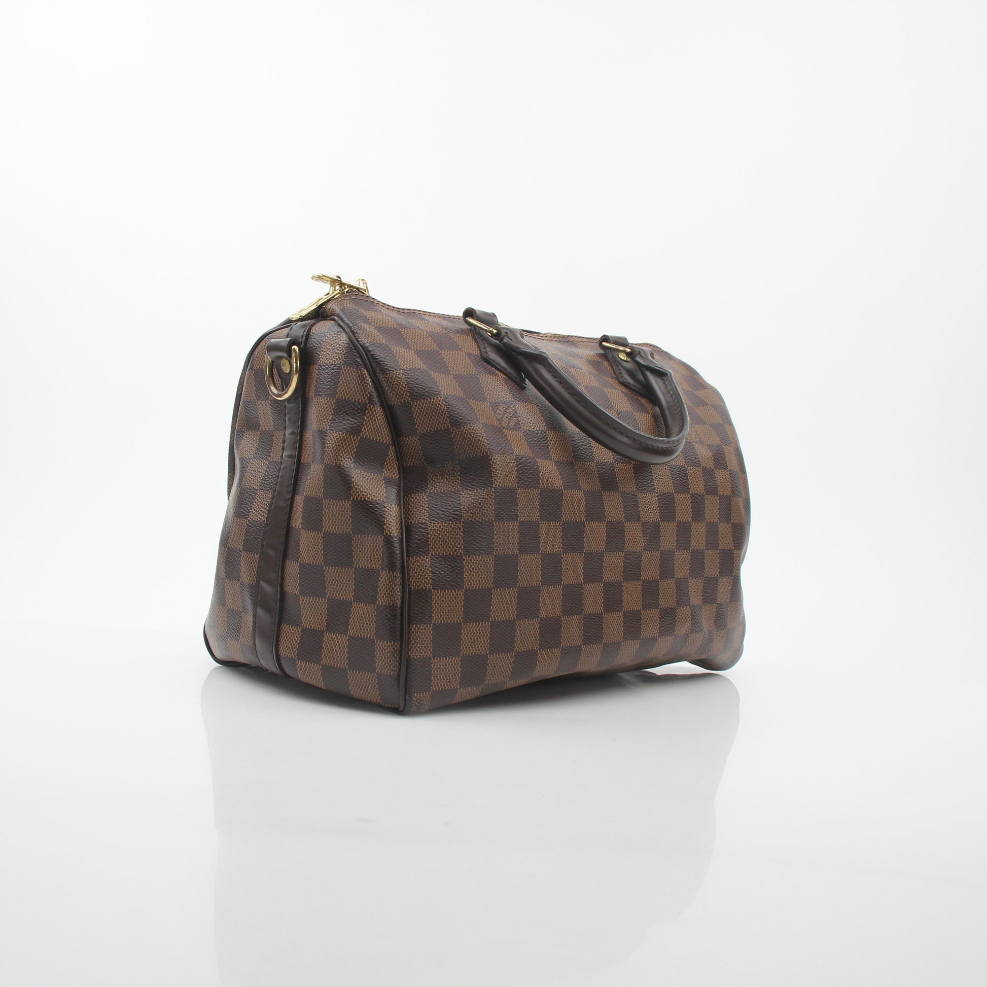 Louis Vuitton Damier Ebene Speedy Bandoulière 30 handbag with leather handles and signature checkered pattern.