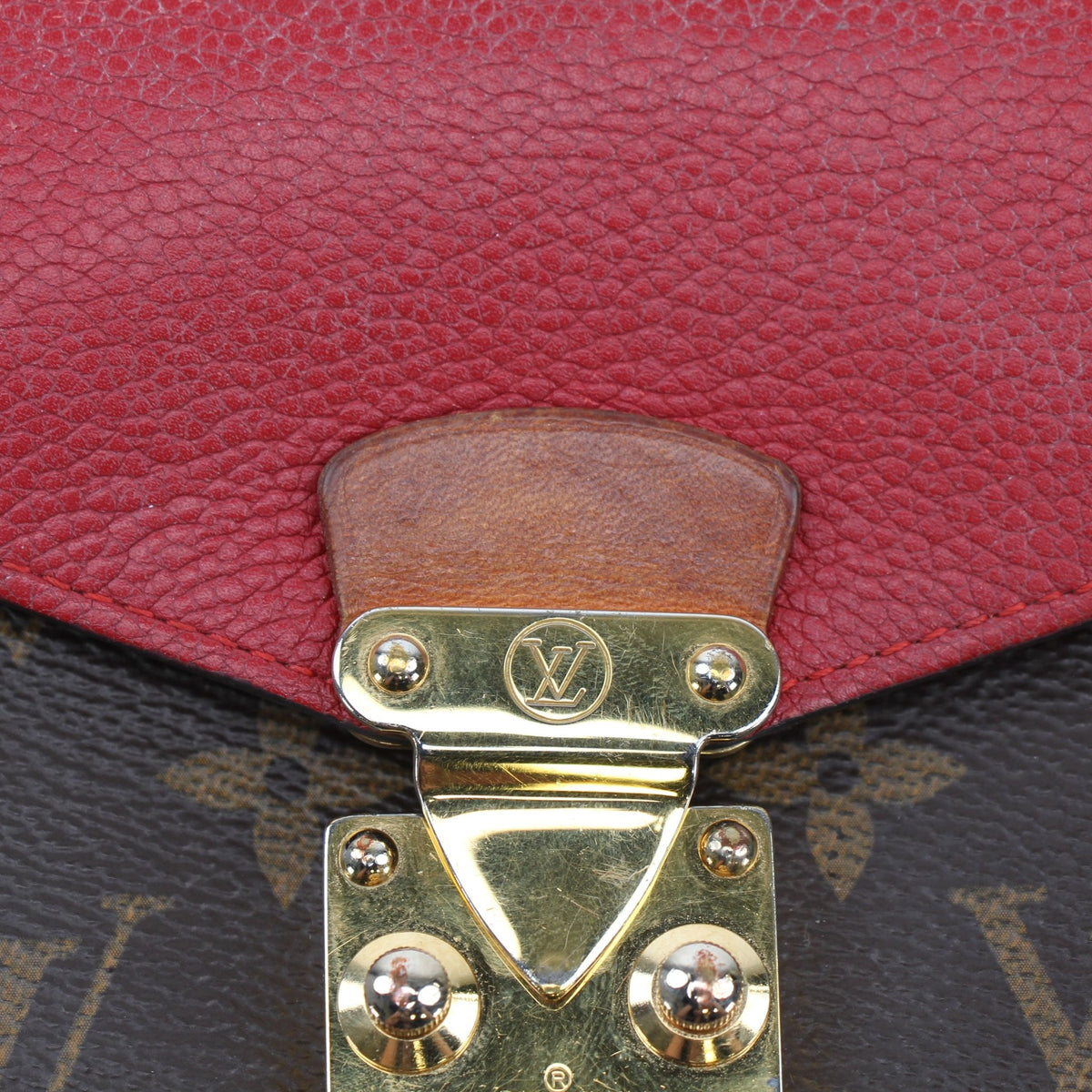 Louis Vuitton brown monogram Pallas wallet with red accents, crafted by Gold & Beyond, shown open with card slots visible.