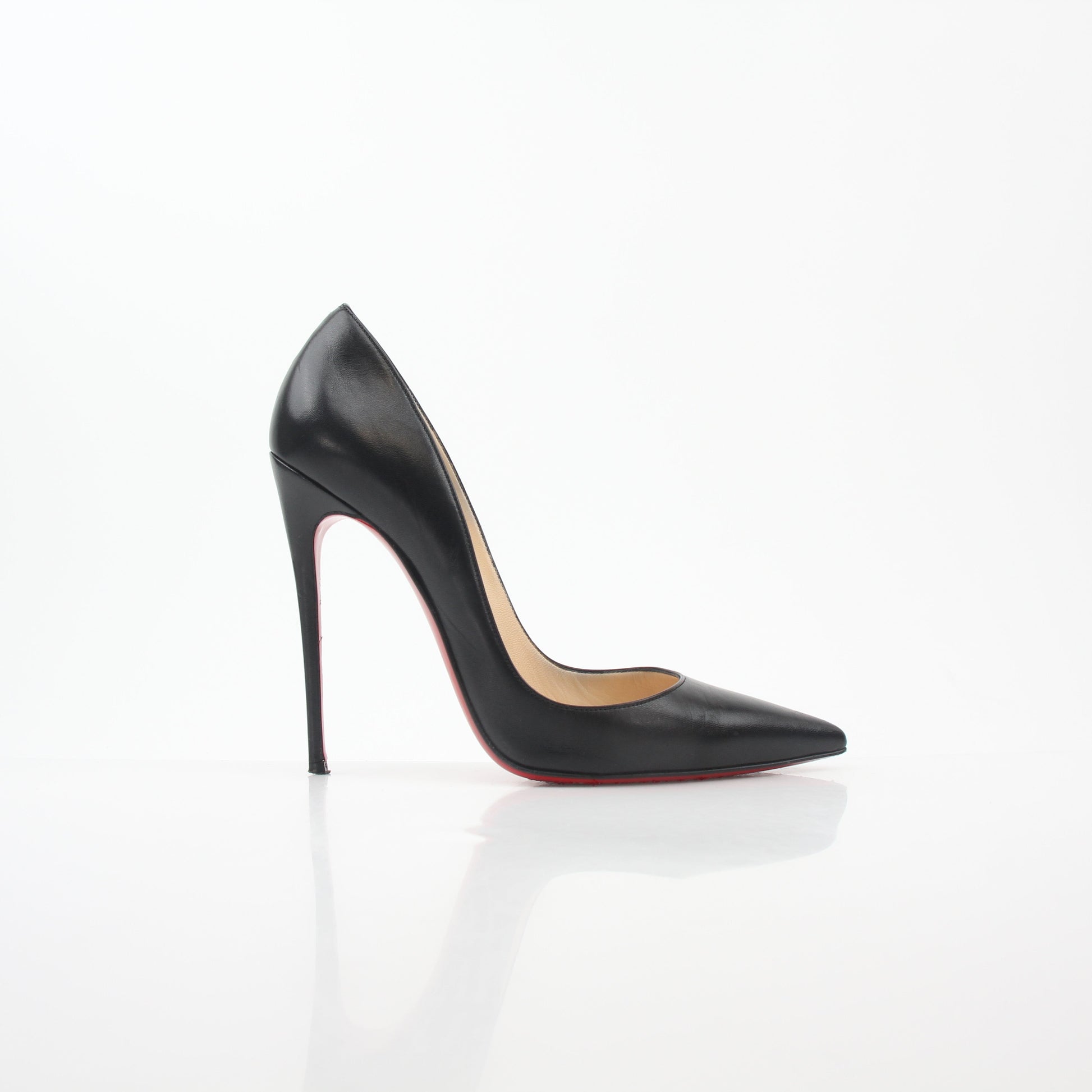 Christian Louboutin So Kate black leather heels with pointed toes and stiletto heels, displayed on a neutral background