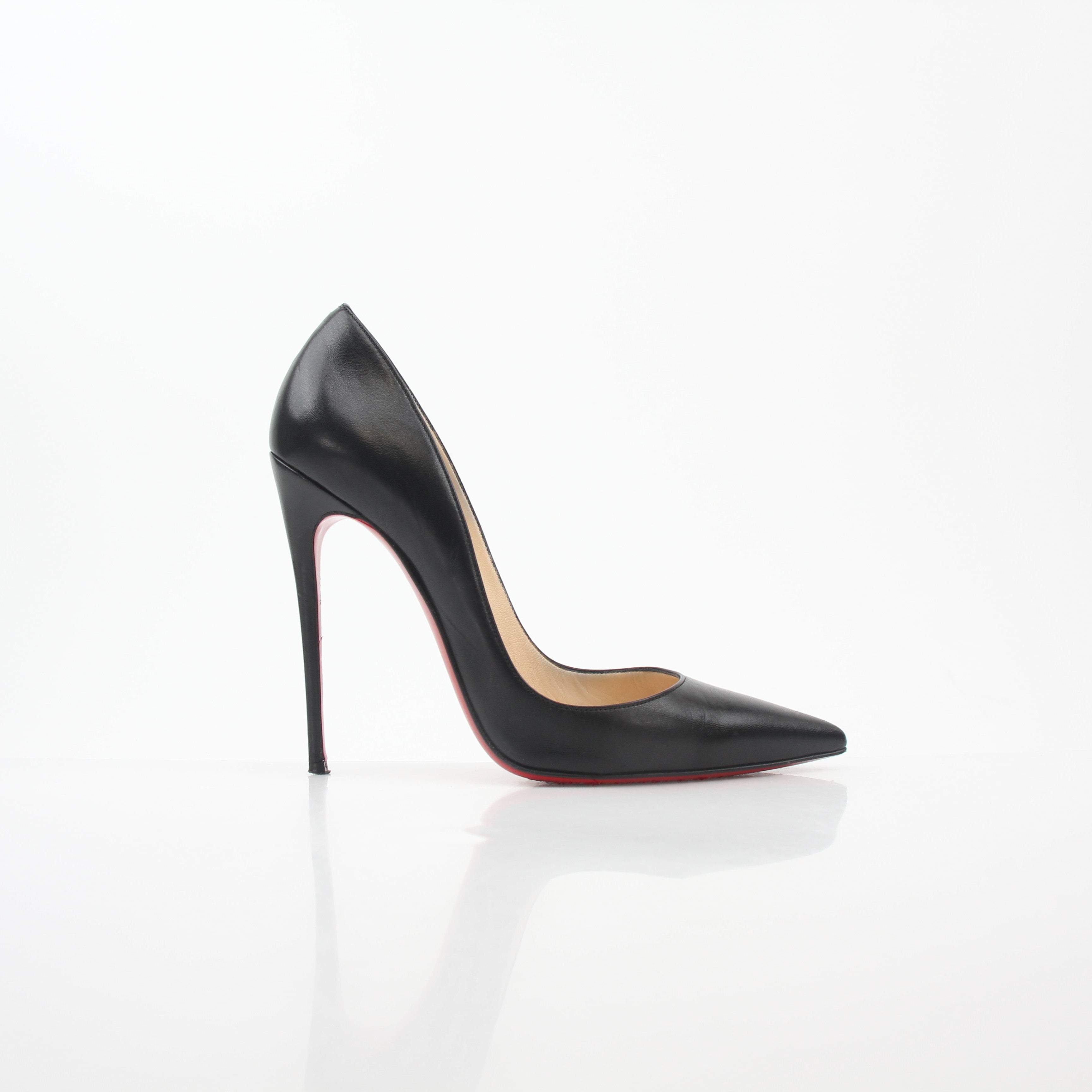 Christian Louboutin So Kate black leather heels with pointed toes and stiletto heels, displayed on a neutral background