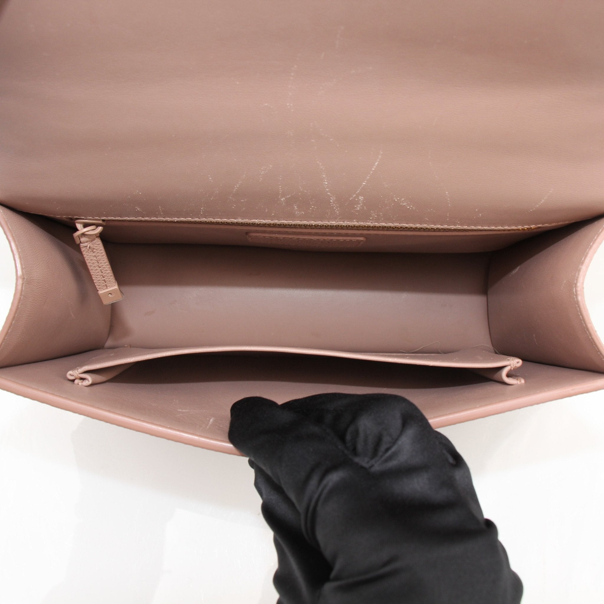 Christian Dior 30 Montaigne handbag by Gold & Beyond, featuring sleek design and high-quality leather, displayed on a neutral background.