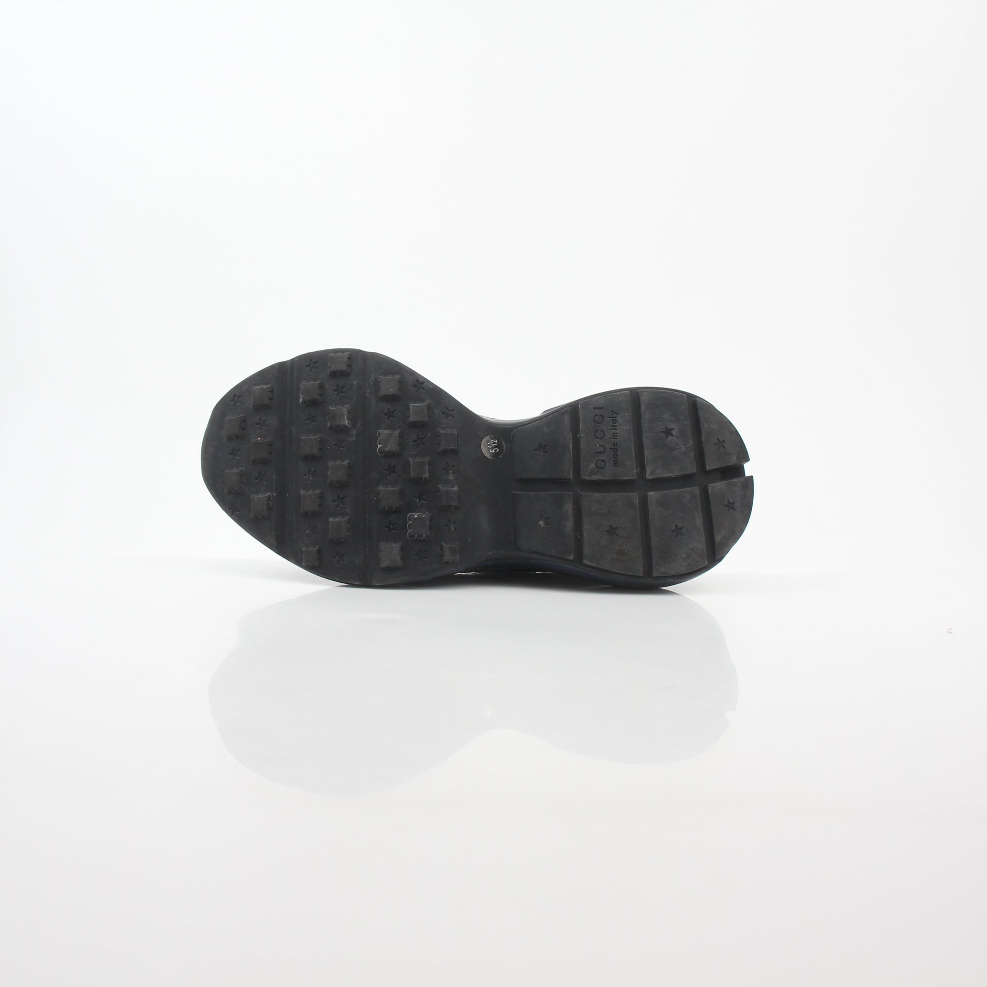 Gucci Rhyton GG Supreme Canvas sneakers with white rubber soles and gold accents, featuring the iconic GG pattern and stylish design.