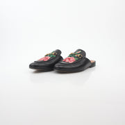 Gold & Beyond Gucci black Princetown leather mule with rose embroidery, stylish slip-on shoes for women.
