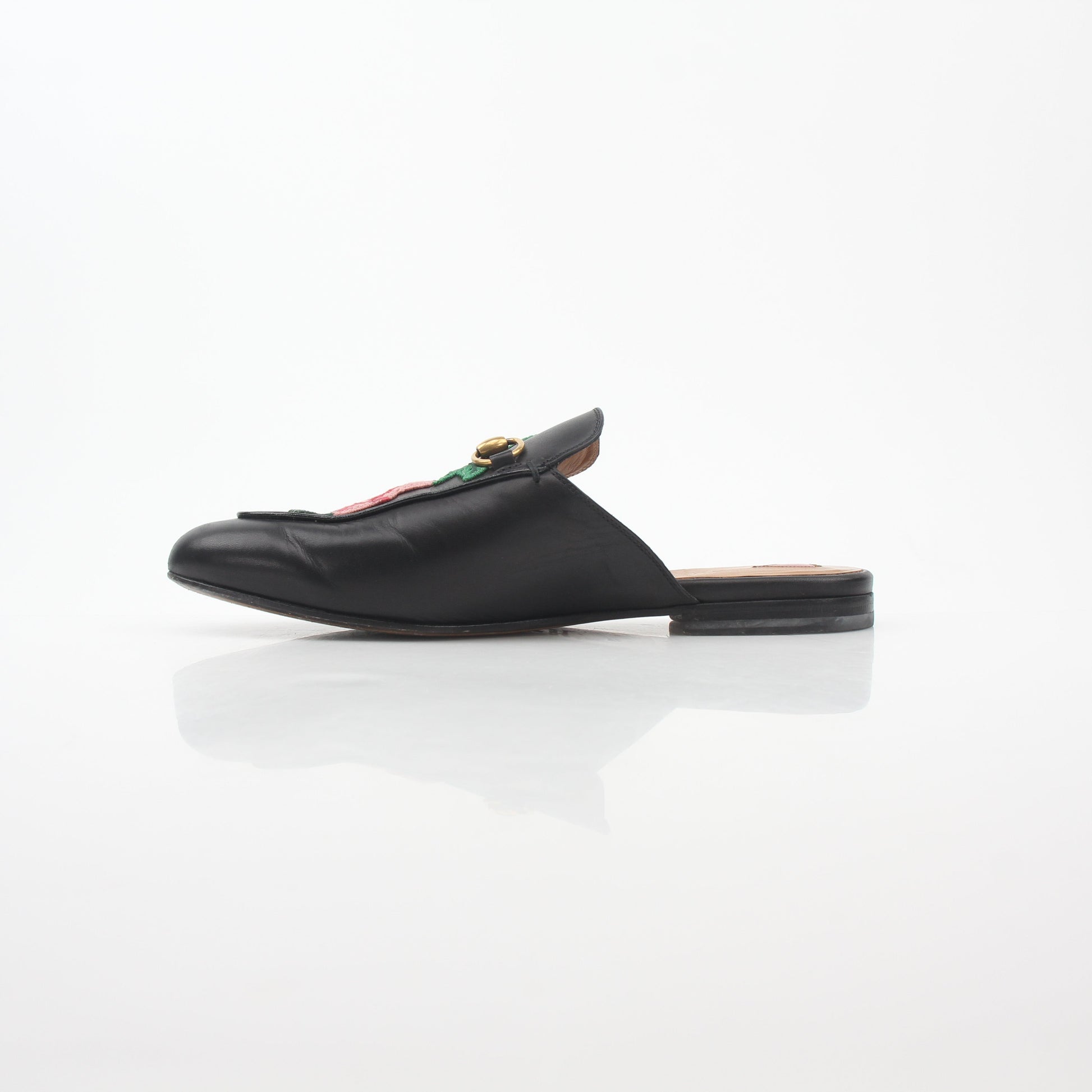 Gucci black Princetown leather mule with rose embroidery, stylish slip-on shoes for women.
