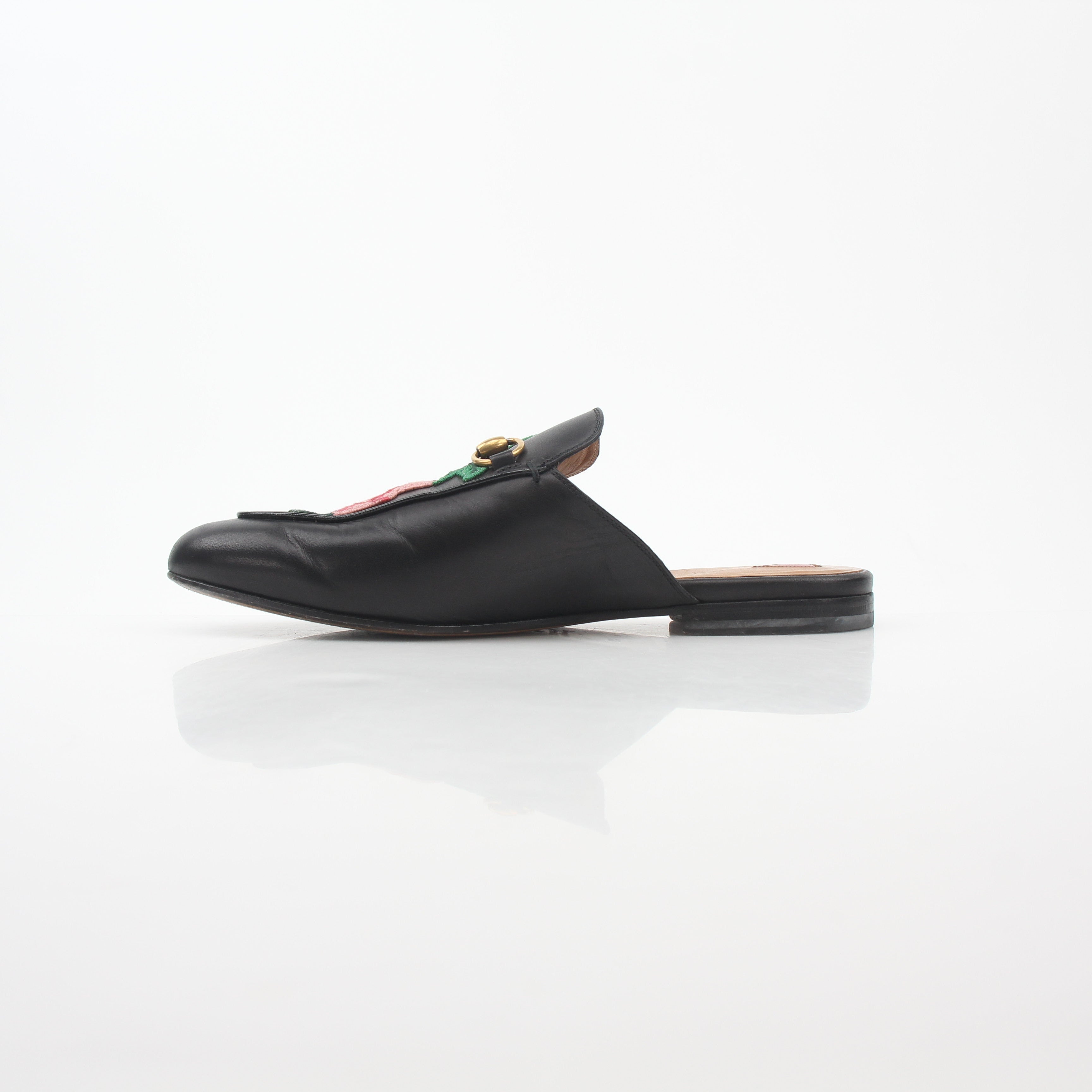 Gucci black Princetown leather mule with rose embroidery, stylish slip-on shoes for women.