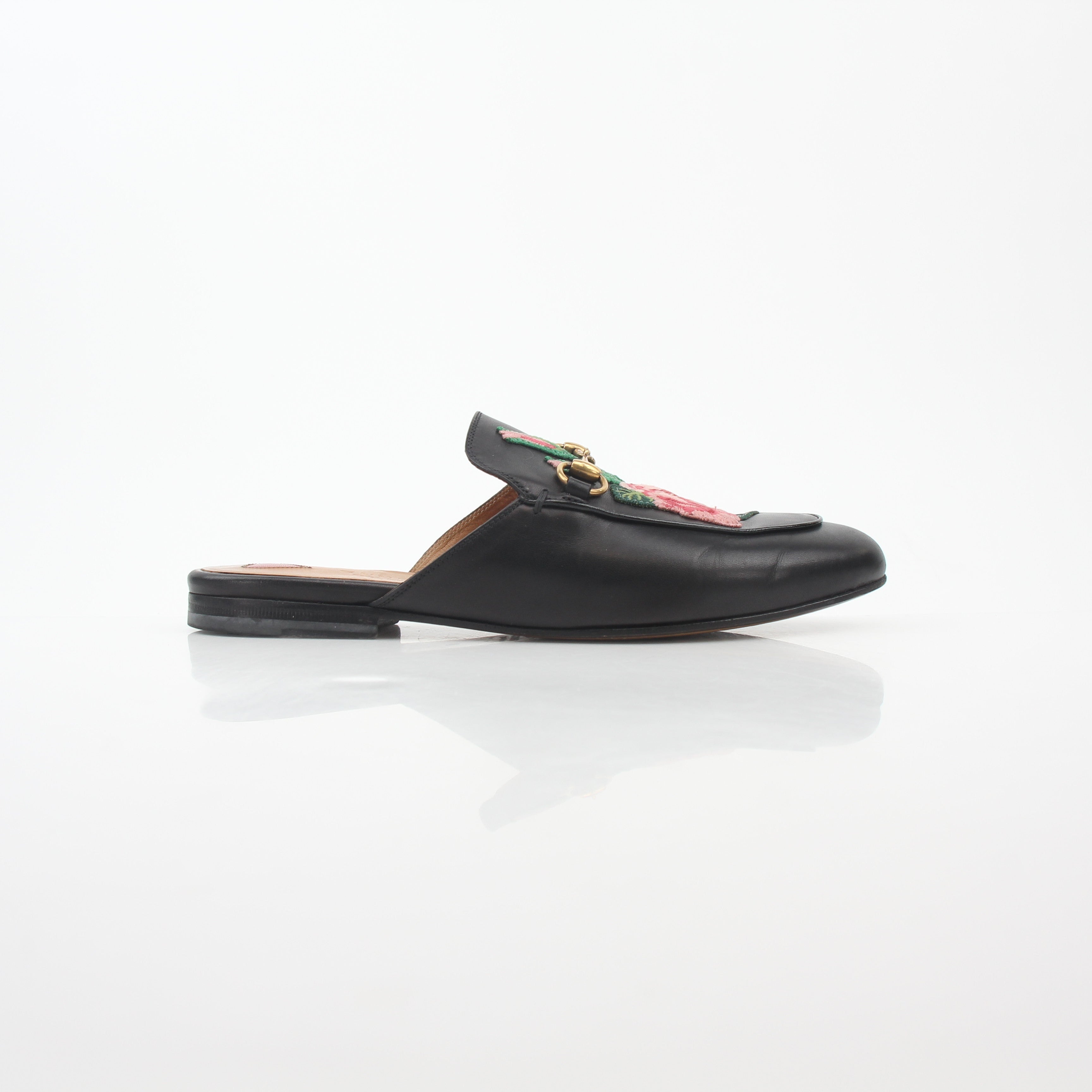 Gucci black Princetown leather mule with rose embroidery, stylish slip-on shoes from Gold & Beyond.