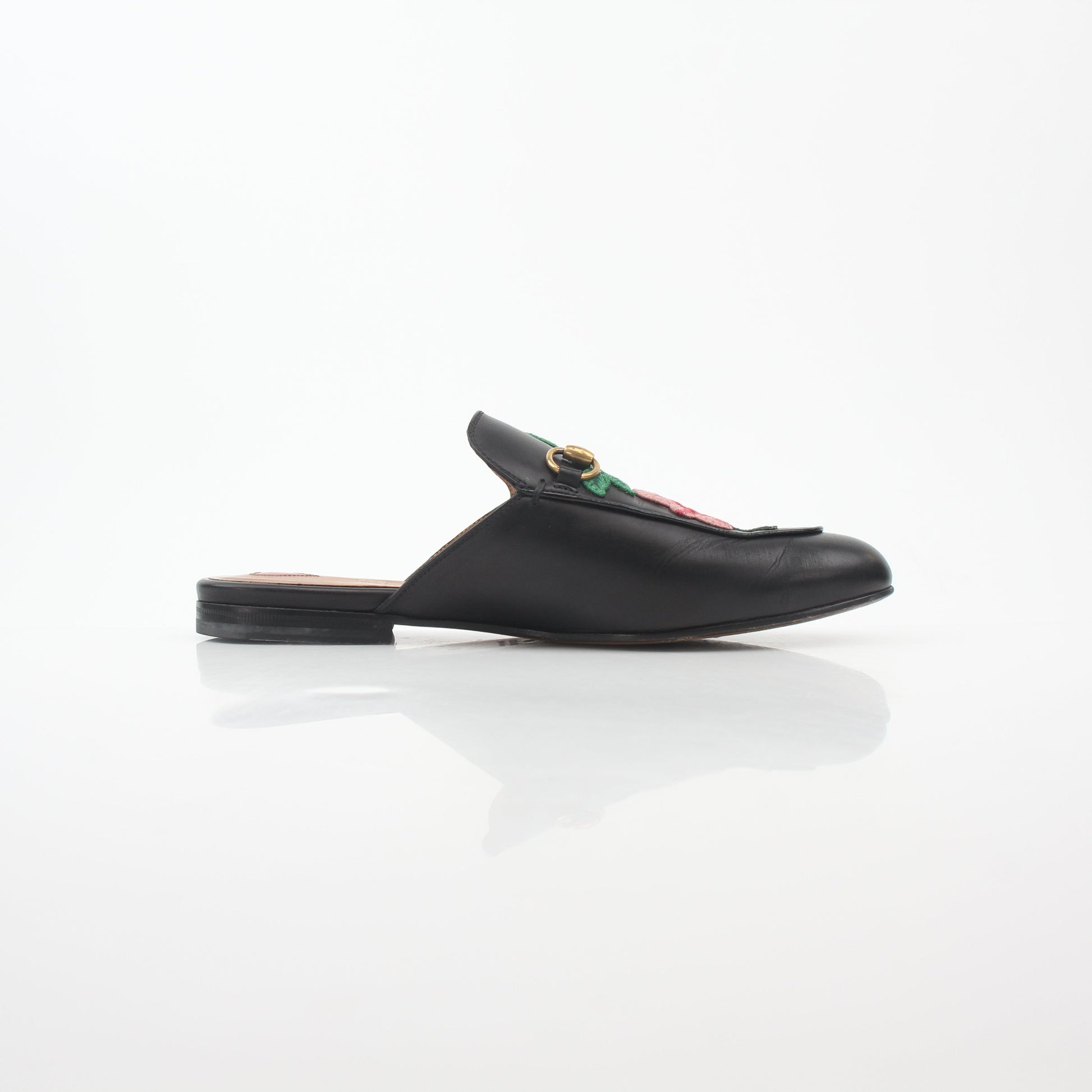 Gucci black Princetown leather mule with rose embroidery, stylish slip-on shoes from Gold & Beyond.
