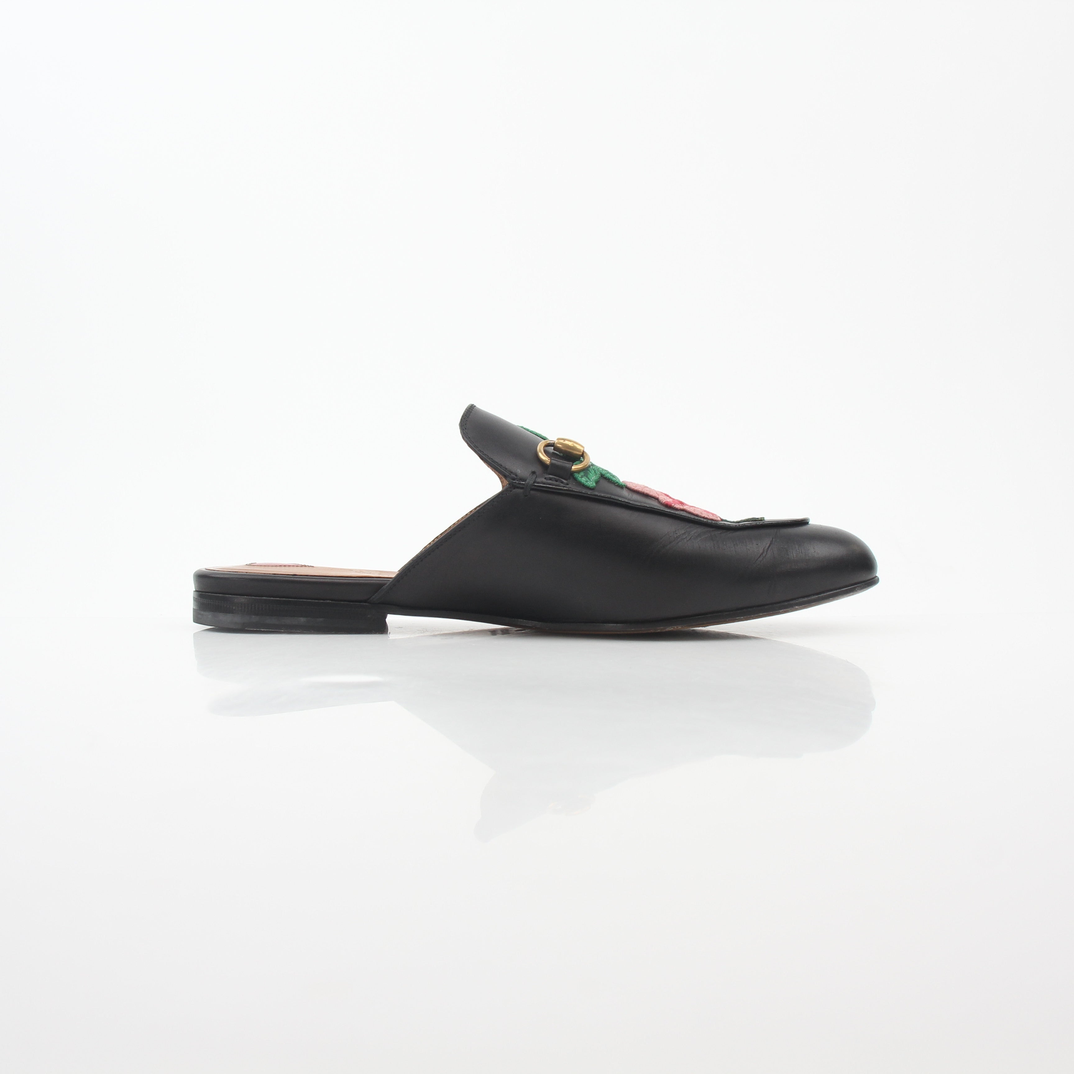 Gucci black Princetown leather mule with rose embroidery, stylish slip-on shoes from Gold & Beyond.