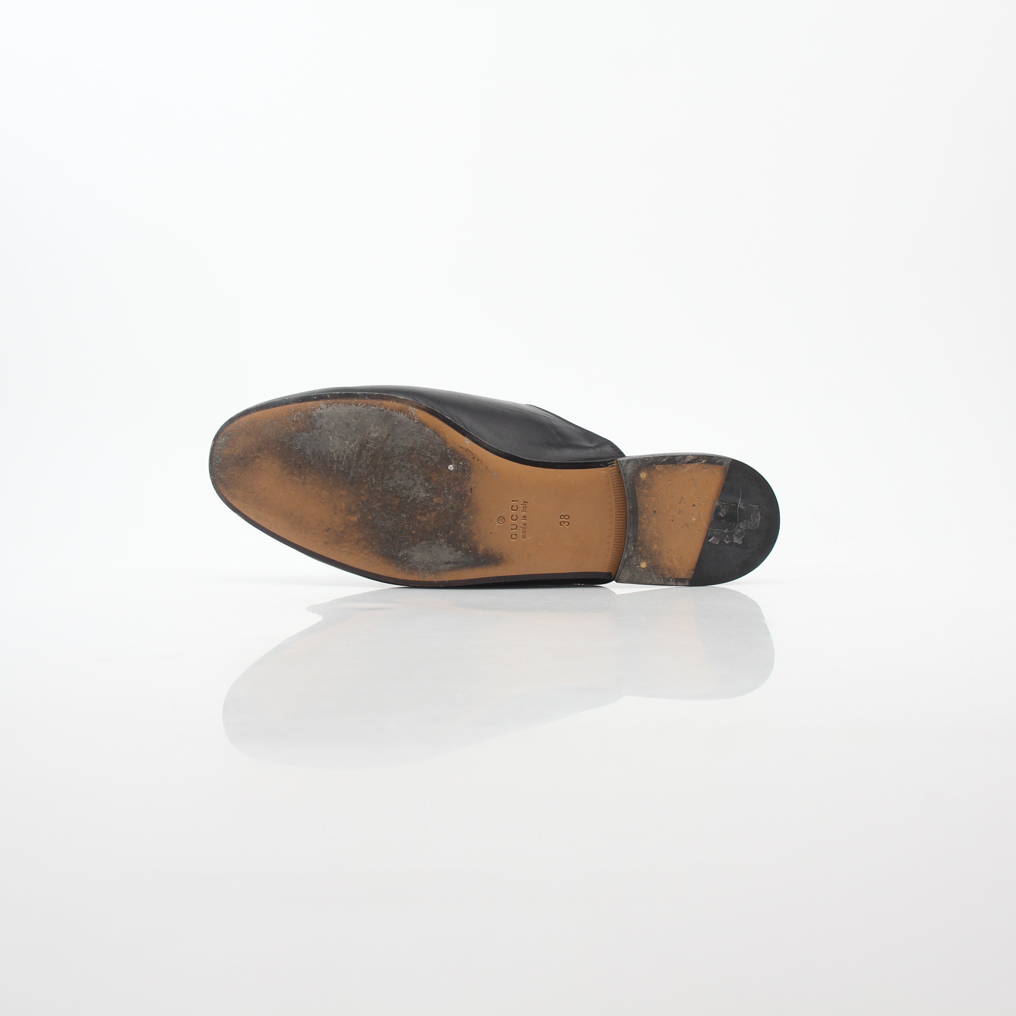 Gucci black Princetown leather mule shoes with rose embroidery, casual slip-on footwear for women.