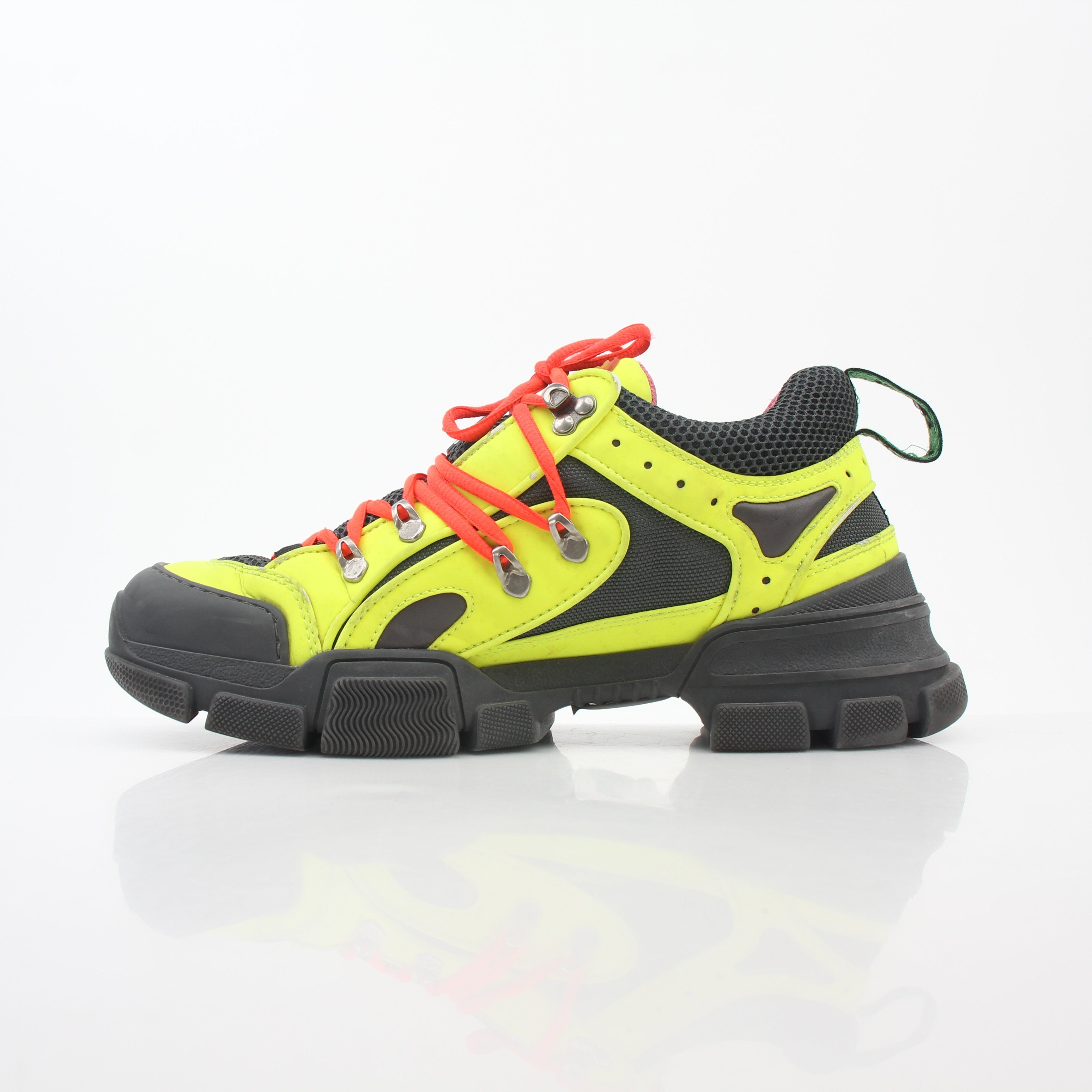 Gucci Neon Yellow Flashtrek reflective sneakers with bold design and reflective details, displayed on a plain background